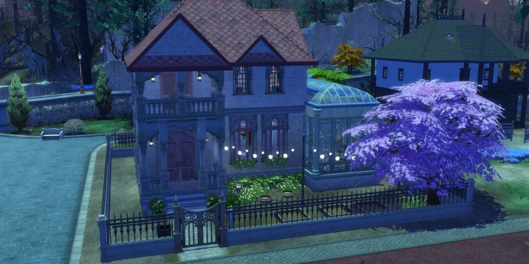 The Mourning Mist Manor from Ravenwood. It is a purple house with lights and a greenhouse.