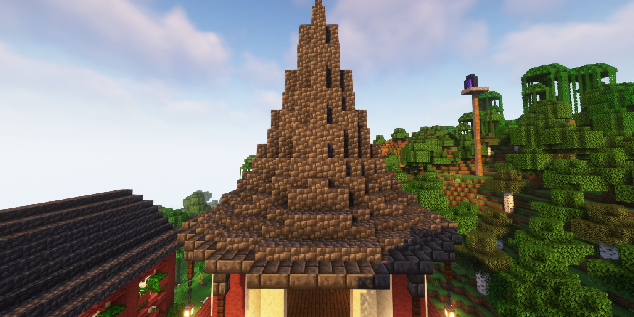 A player looking at a spire castle roof in Minecraft.