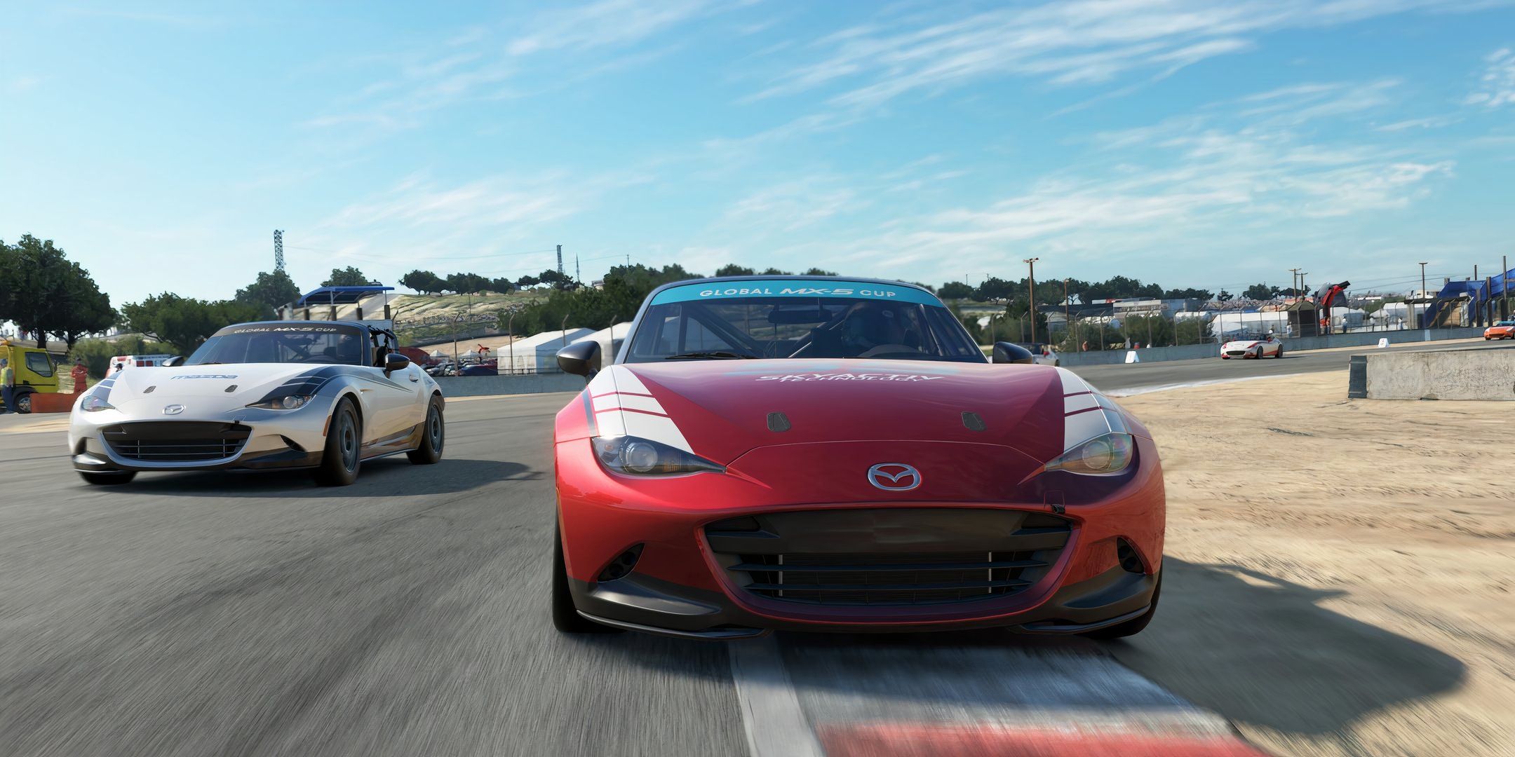 Two Mazda cars racing in Assetto Corsa Evo.