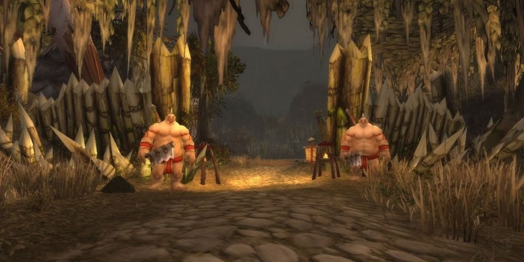 Two ogres stand in front of the entrance to Dustwallow Marsh.