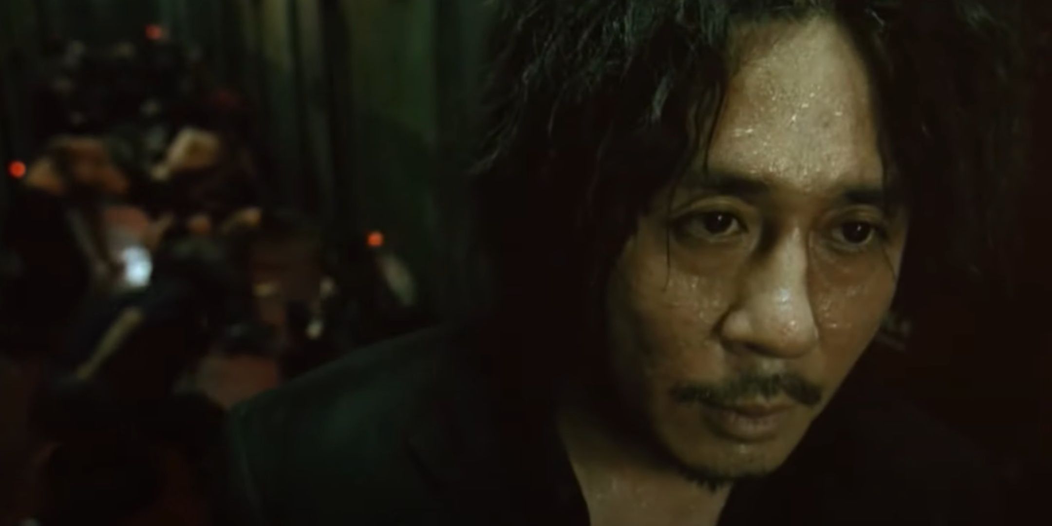 A sweaty Park Dae-su after beating up a group of hooligans in Oldboy.