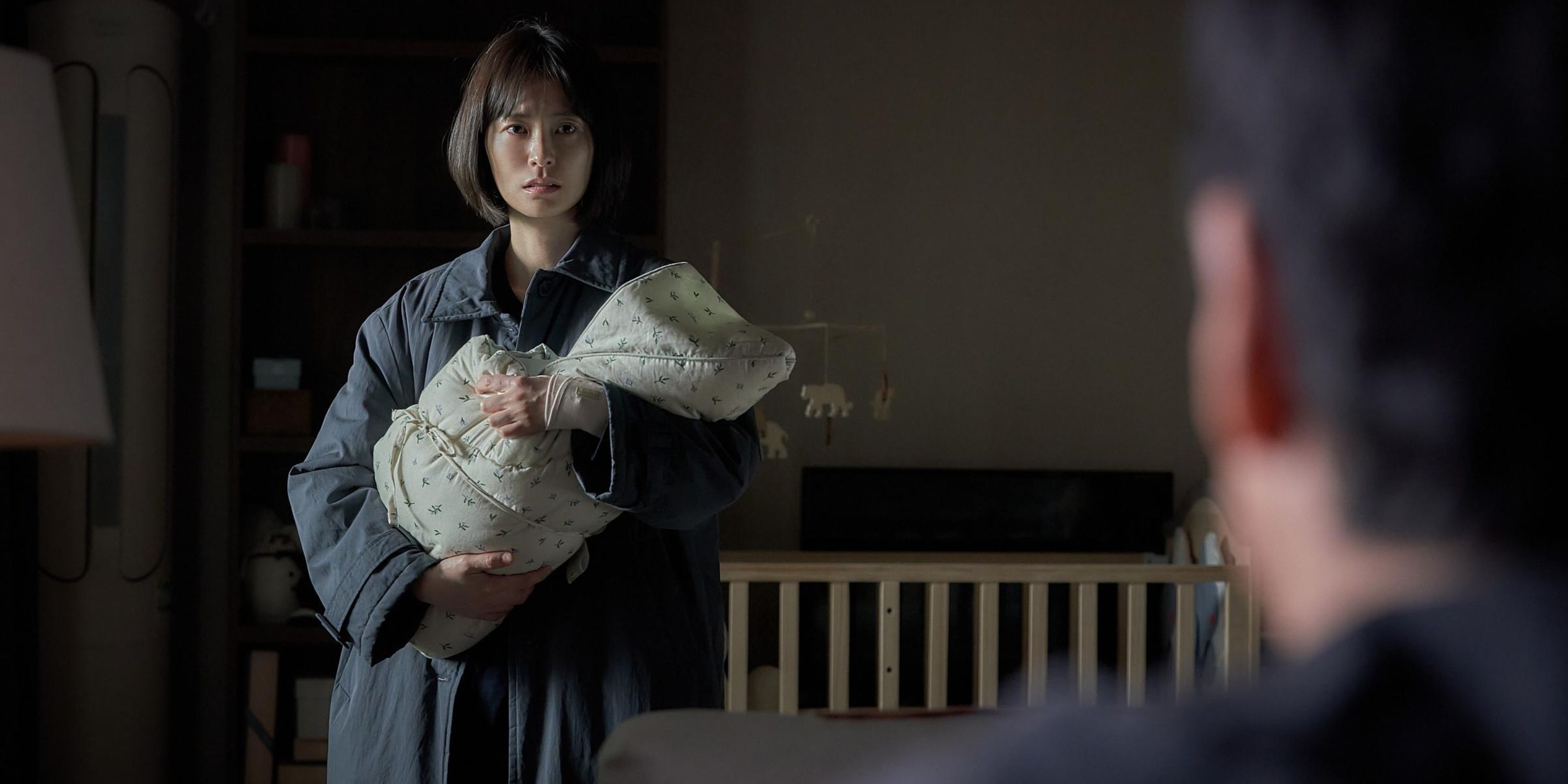 Soo-jin holds on to her newborn in Sleep.
