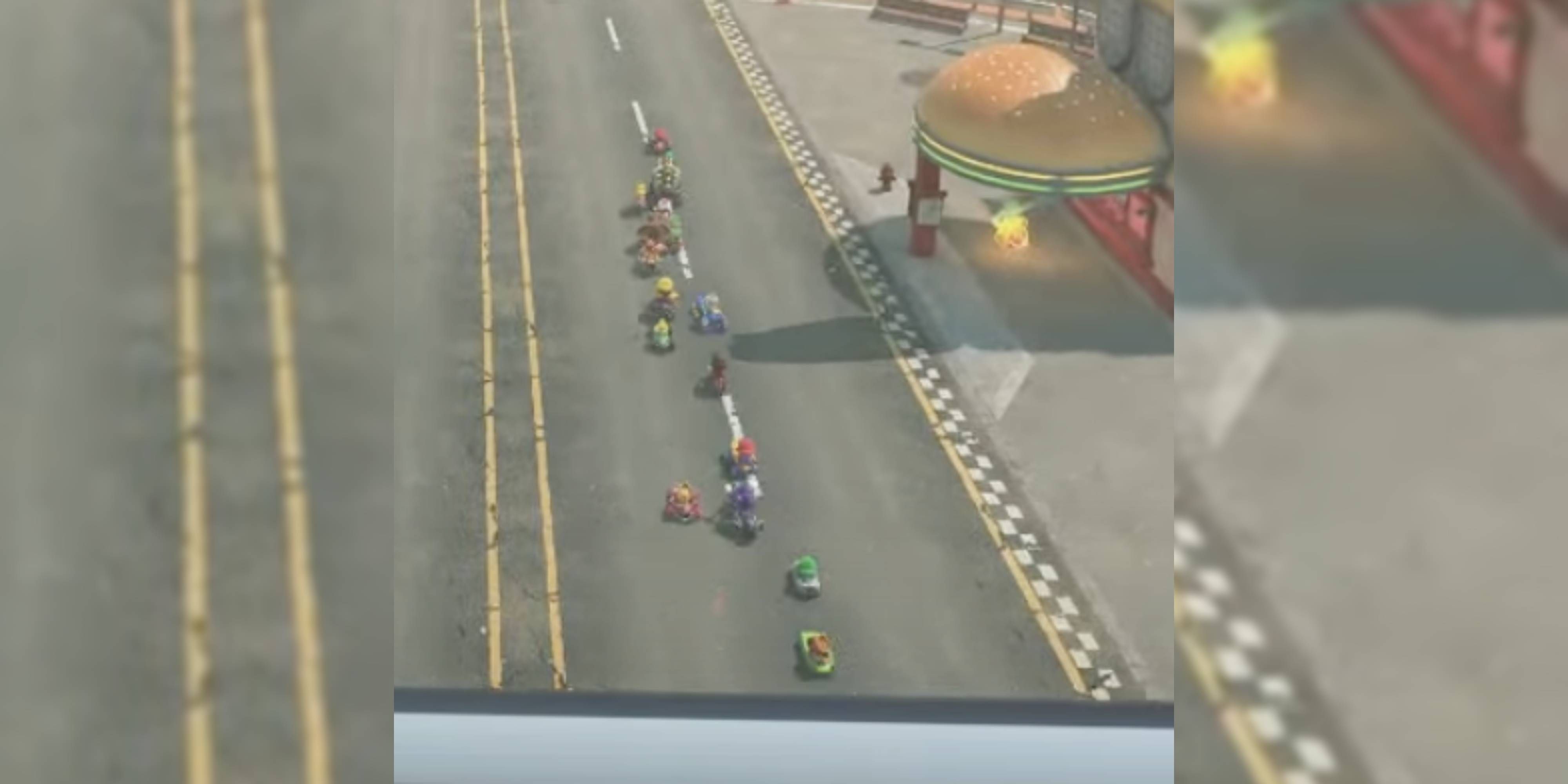 15 racers on a mario kart track.