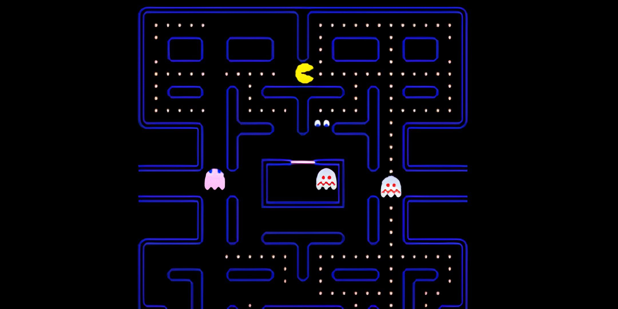 Pac-Man in a maze with frightened ghosts around.
