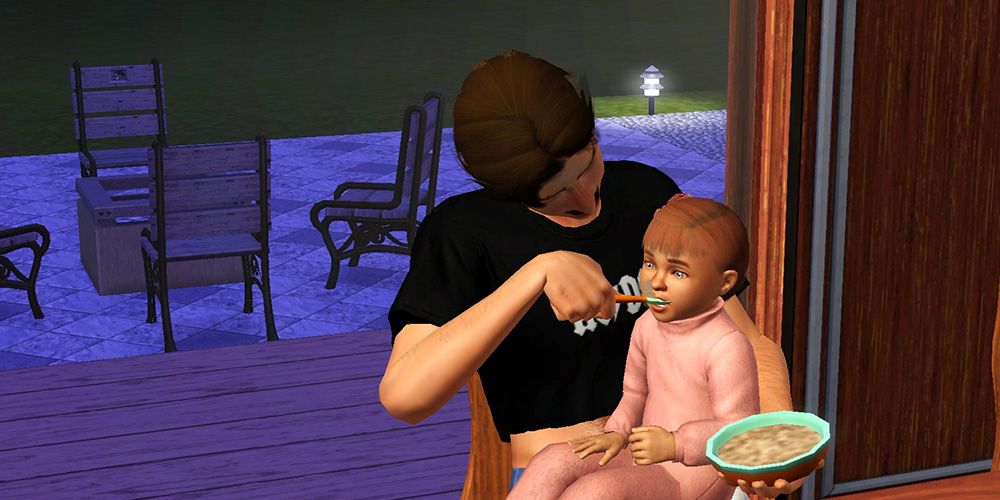 A Sim feeds a toddler in his lap, showcasing an interaction added by the More Toddler Interactions mod.