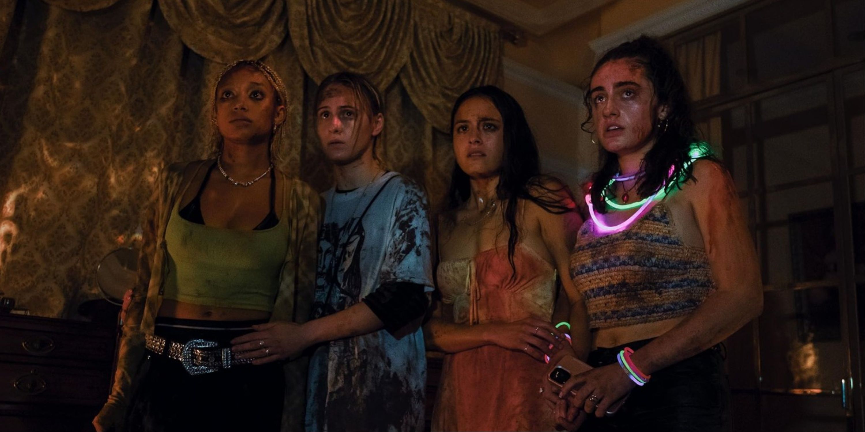 Maria Bakalova, Amandla Stenberg, Rachel Sennott, and Chase Sui Wonders covered in blood in Bodies Bodies Bodies.