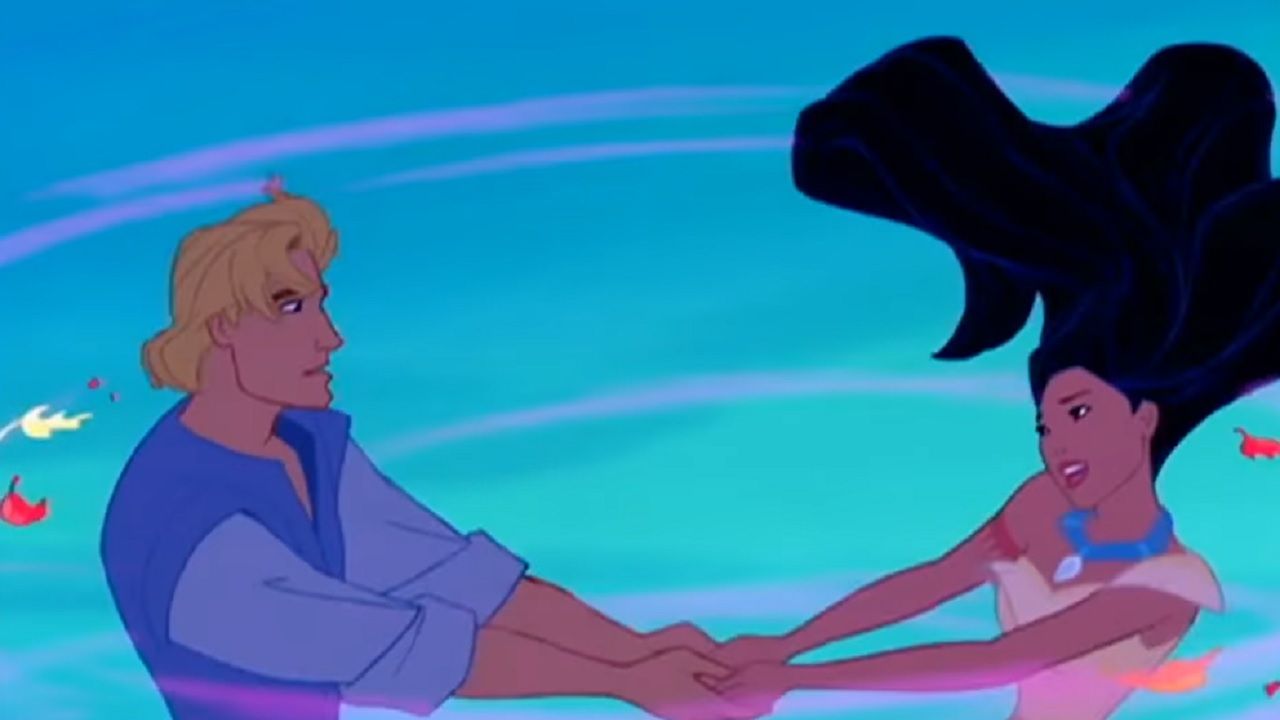 A still frame from Disney's Pocahontas, showing John Smith holding hands with Pocahontas.