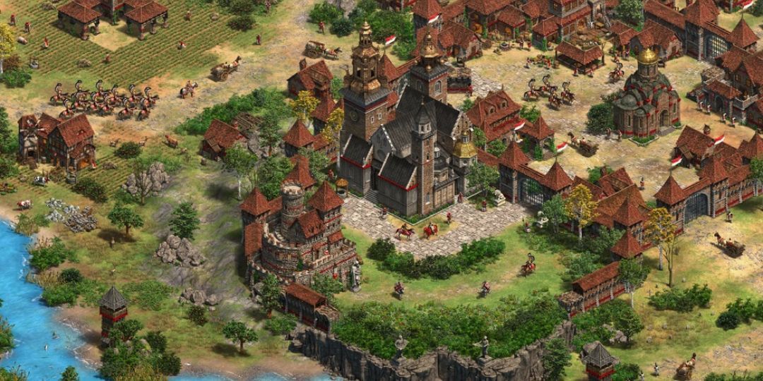 A Polish town, filled with churches and stone buildings, is shown in Age of Empire 2.