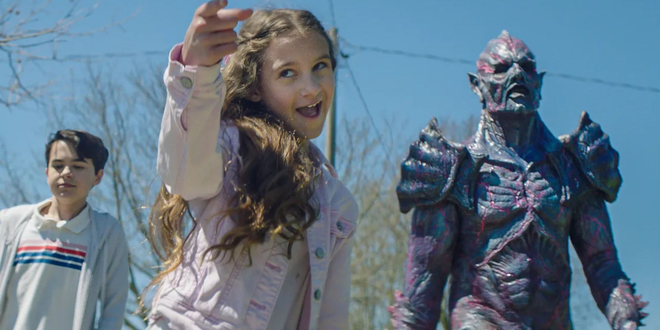 Mimi, Luke, and the alien overlord walk outside. 