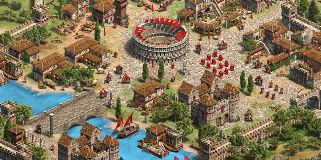 Rome from Age Of Empires 2 is shown. A massive coliseum sits in the center of a town.