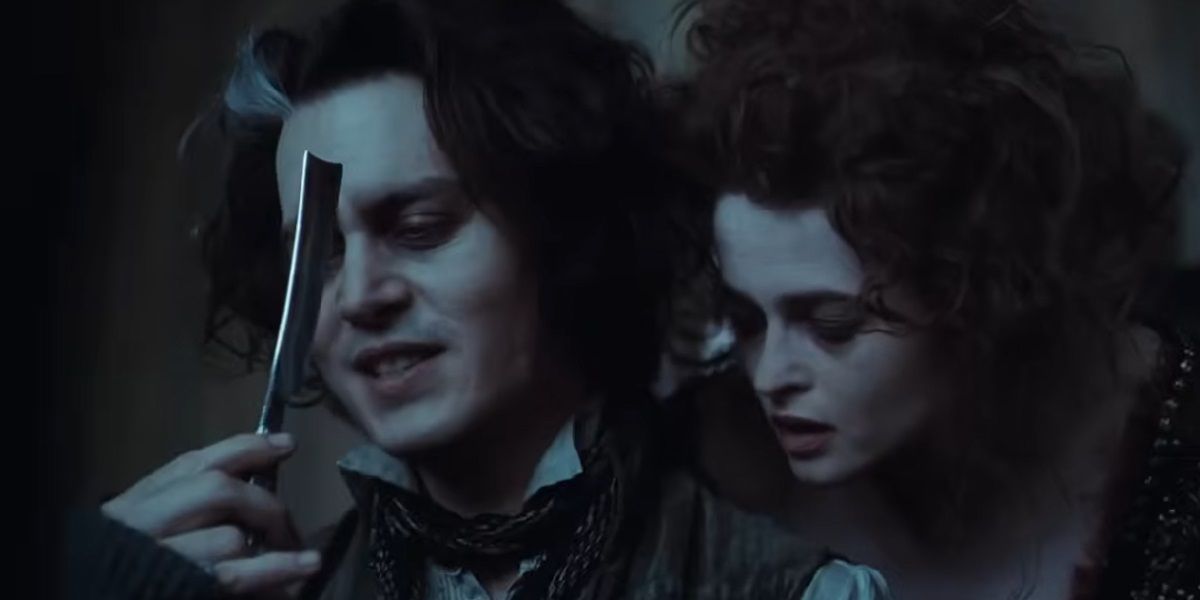 Sweeney Todd and Mrs Lovett look at a shaving razor in Sweeney Todd: The Demon Barber of Fleet Street.
