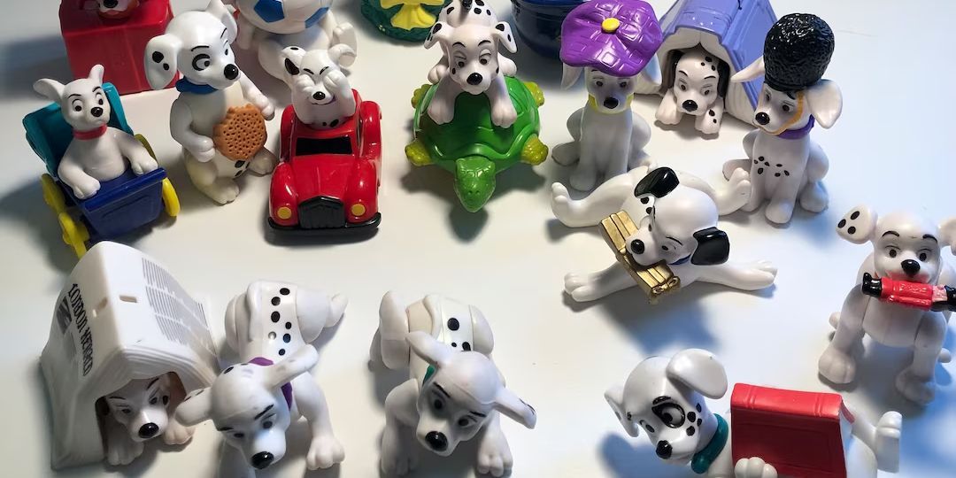 A pile of 101 Dalmations toys sits on a white table.