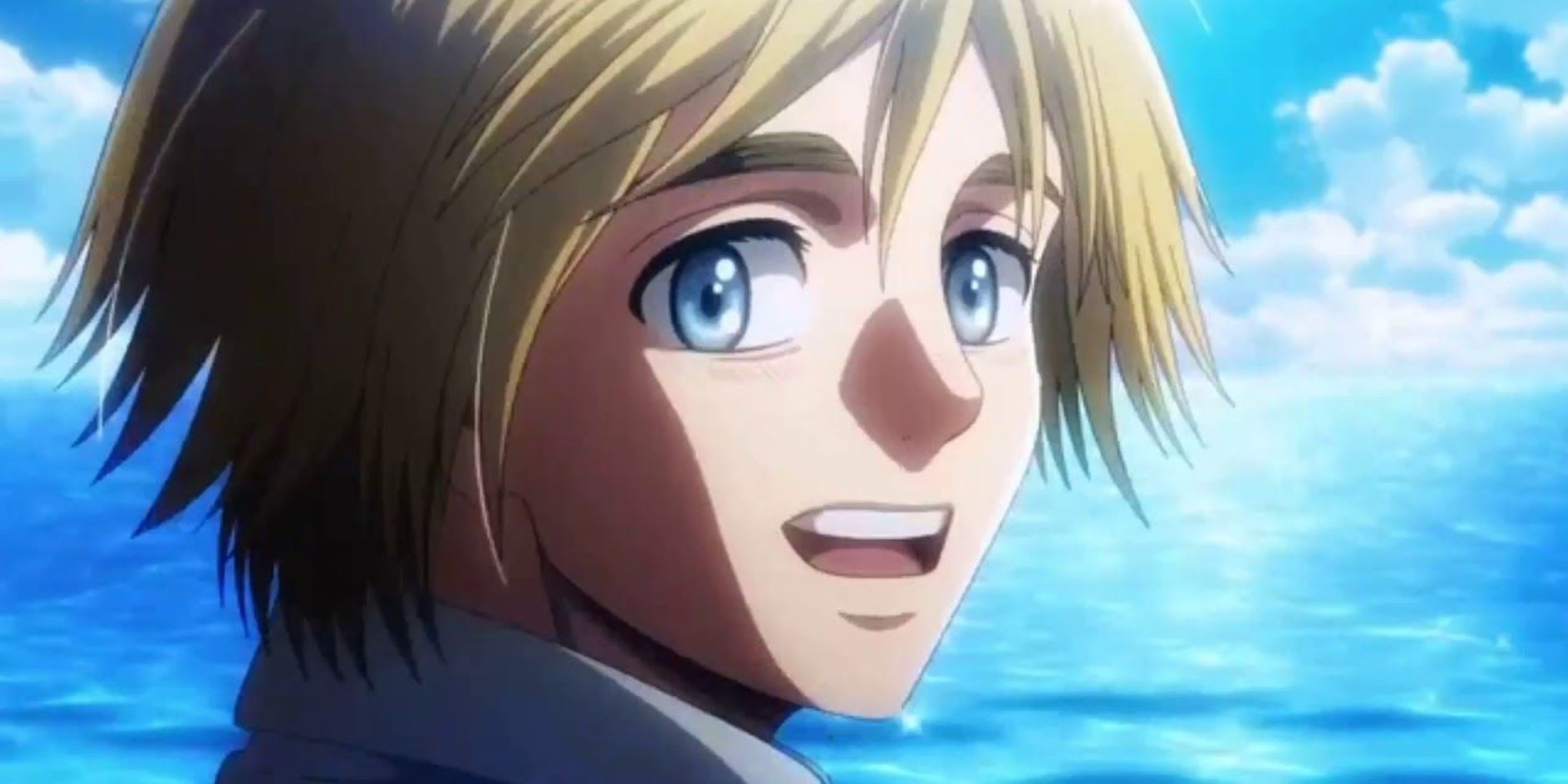 Armin close up against an ocean and sky in Attack on Titan.