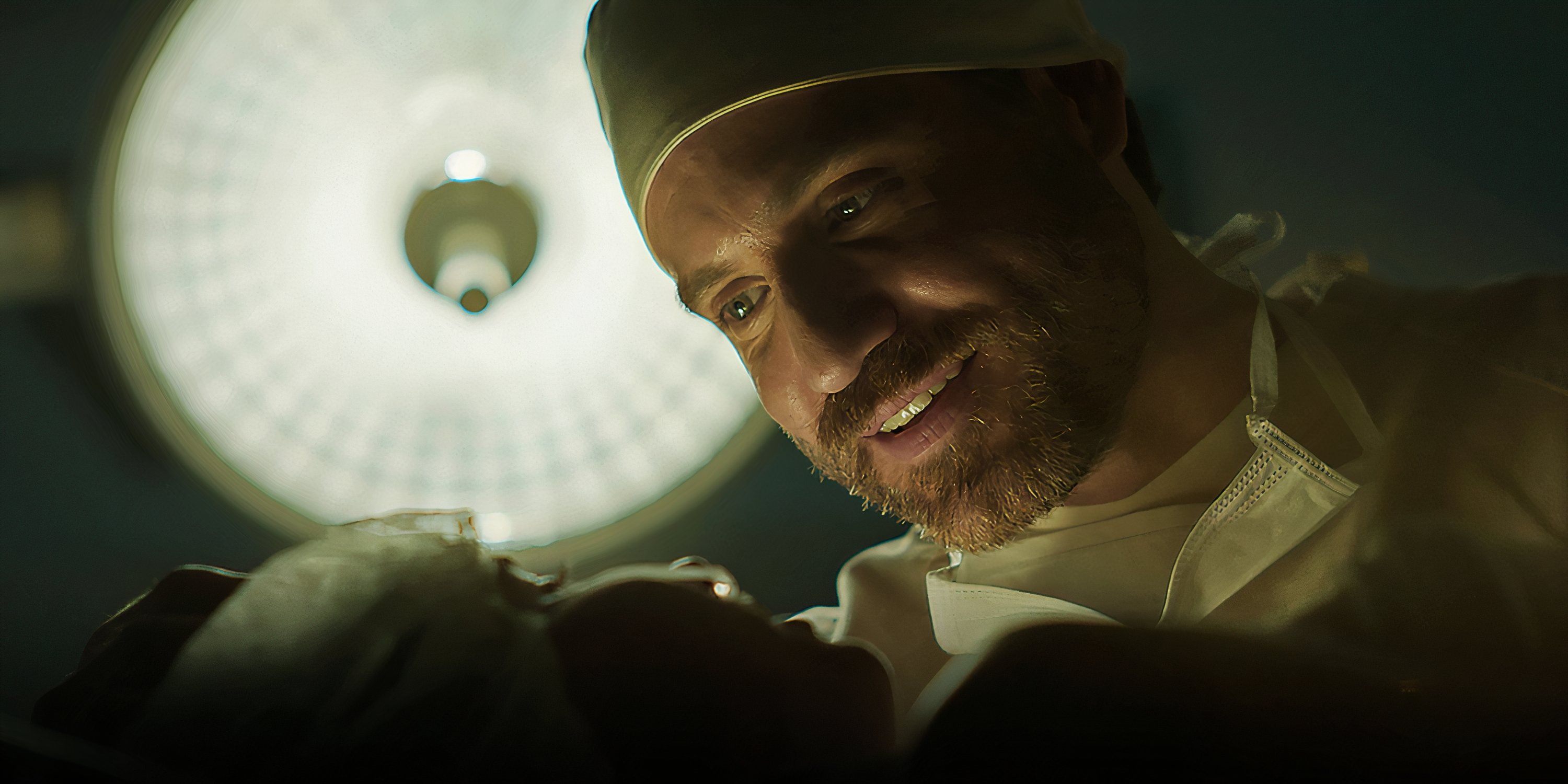 Dr. Paolo Macchiarini leans over a patient in Dr. Death.
