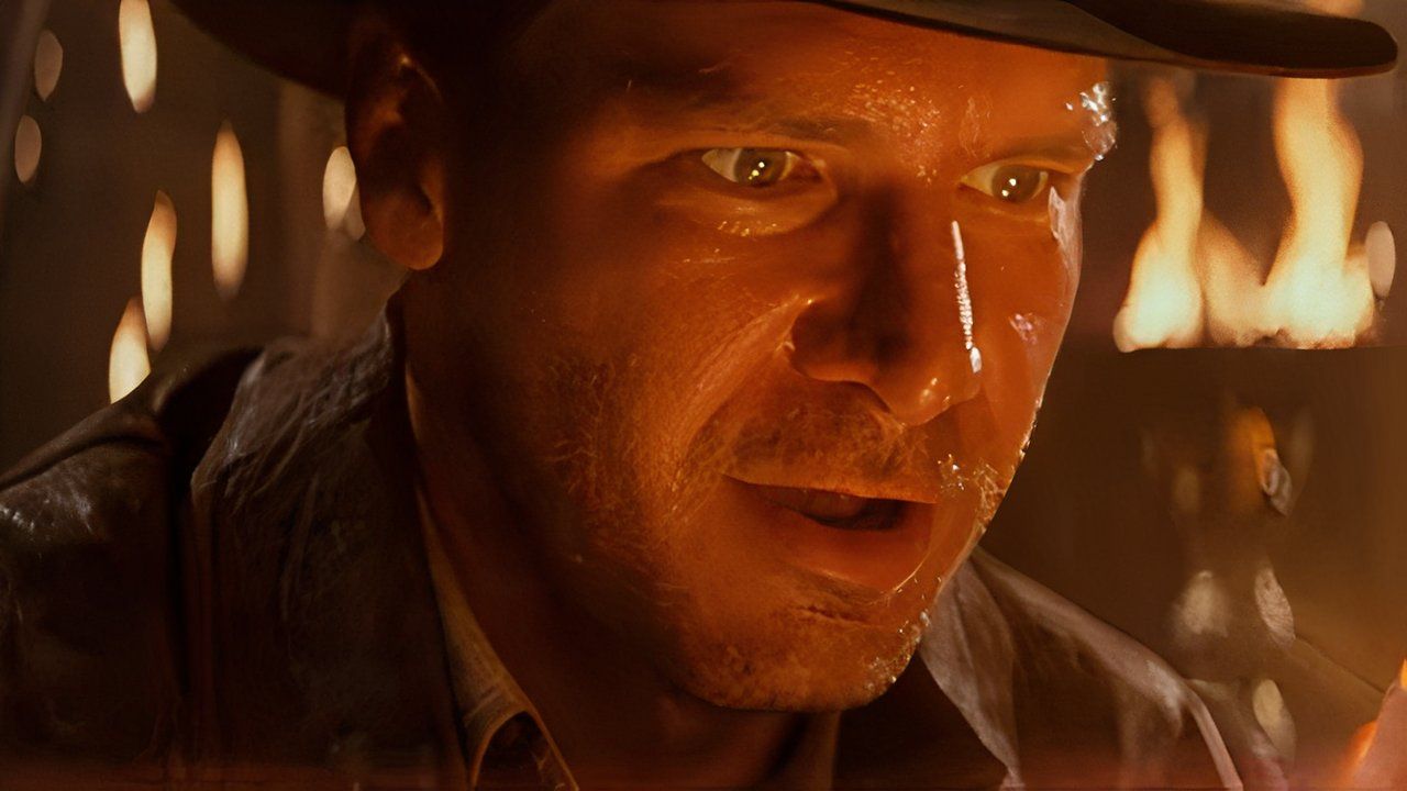 Indiana Jones looking awed while holding an artifact in Indiana Jones and the Temple of Doom.