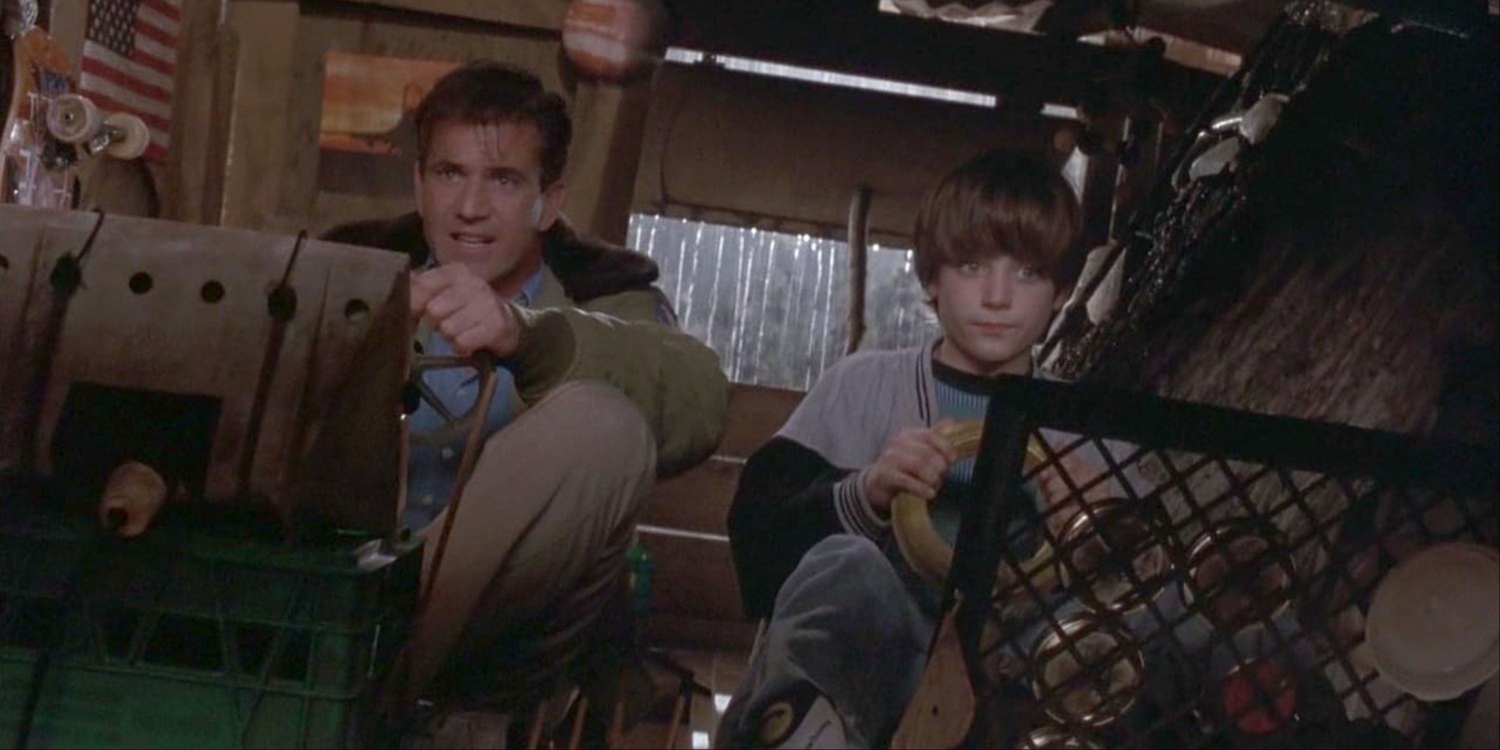 Mel Gibson and a young Elijah Wood playing together in Forever Young.