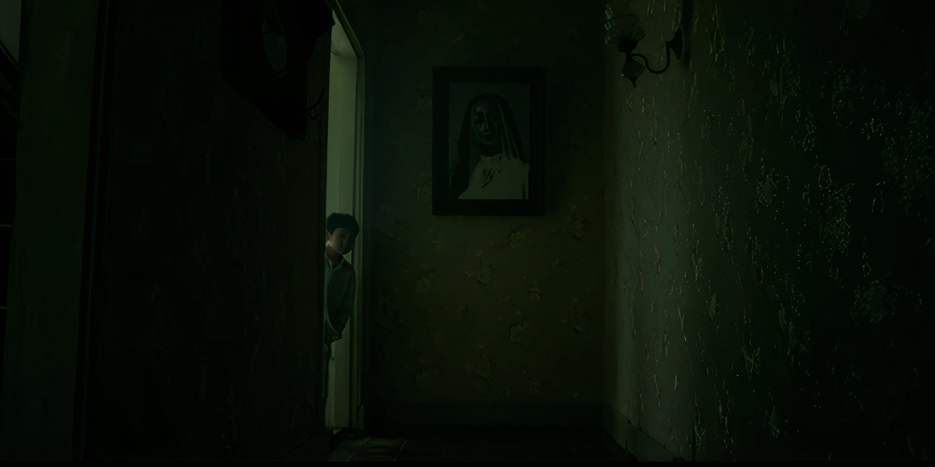 Ian peeks warily out into the dark hallway in Satan's Slaves.