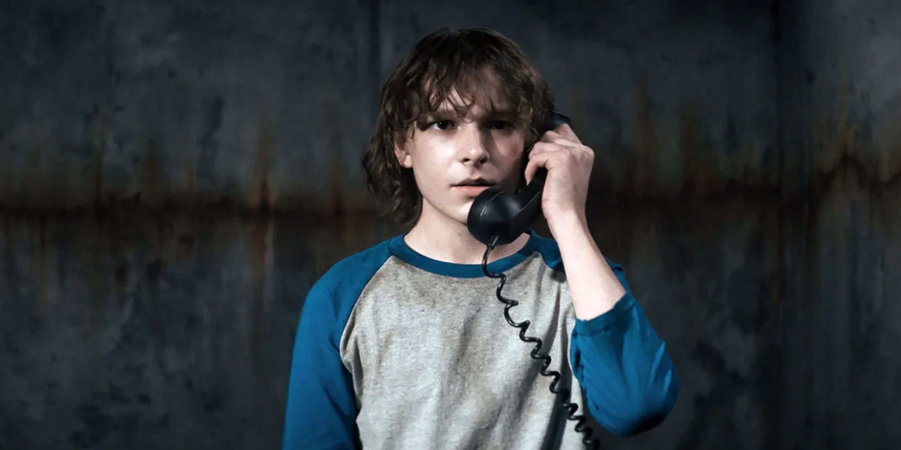 Finney Shaw answers the telephone in The Black Phone.