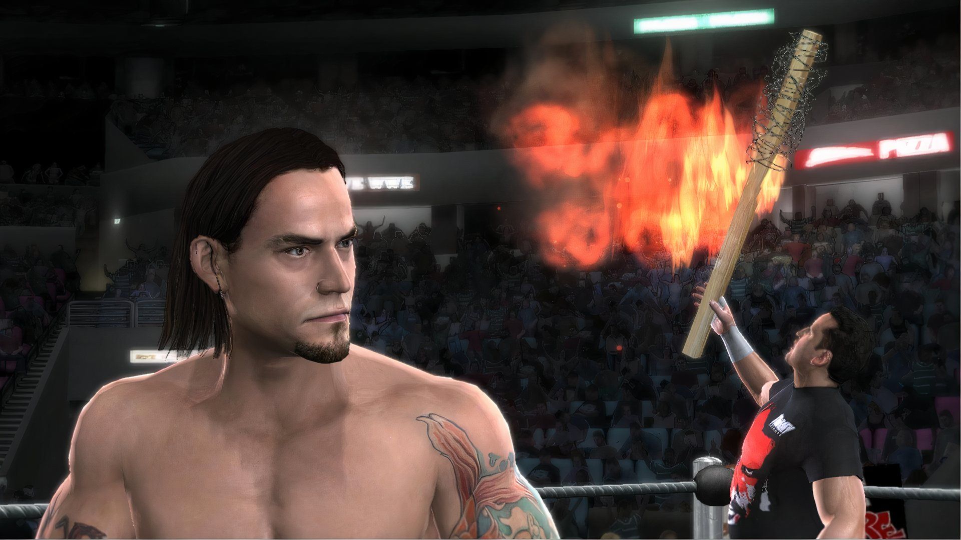 Tommy Dreamer prepares to hit CM Punk with a flaming kendo stick in WWE Smackdown vs. Raw 2008.
