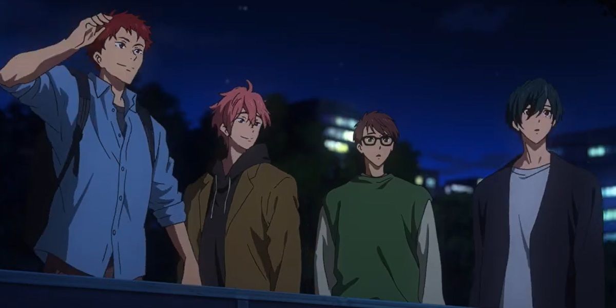 The cast of the anime Free look out over a school rooftop.