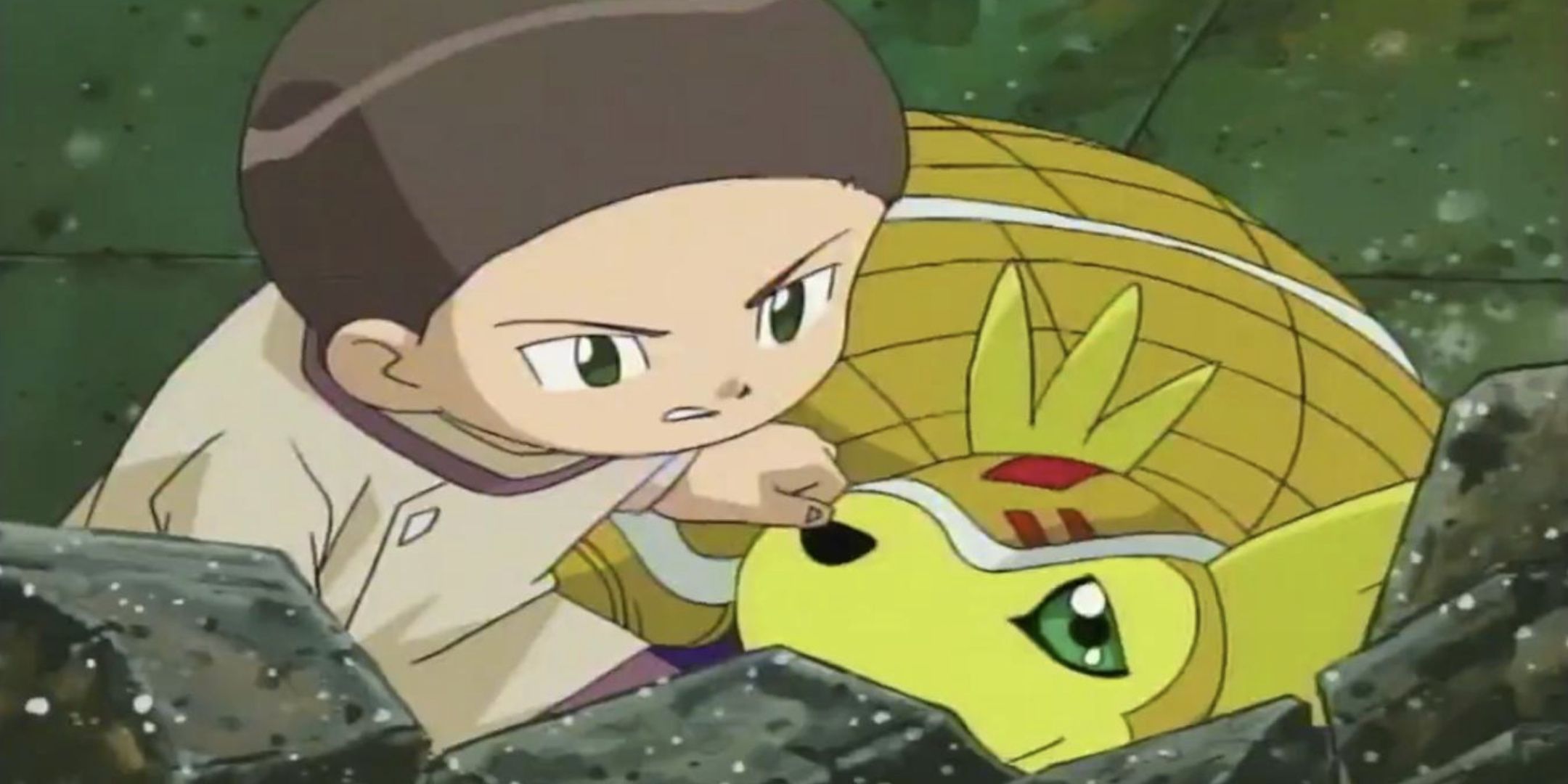 Cody and Armadillomon hiding from danger in Digimon Adventure 02.