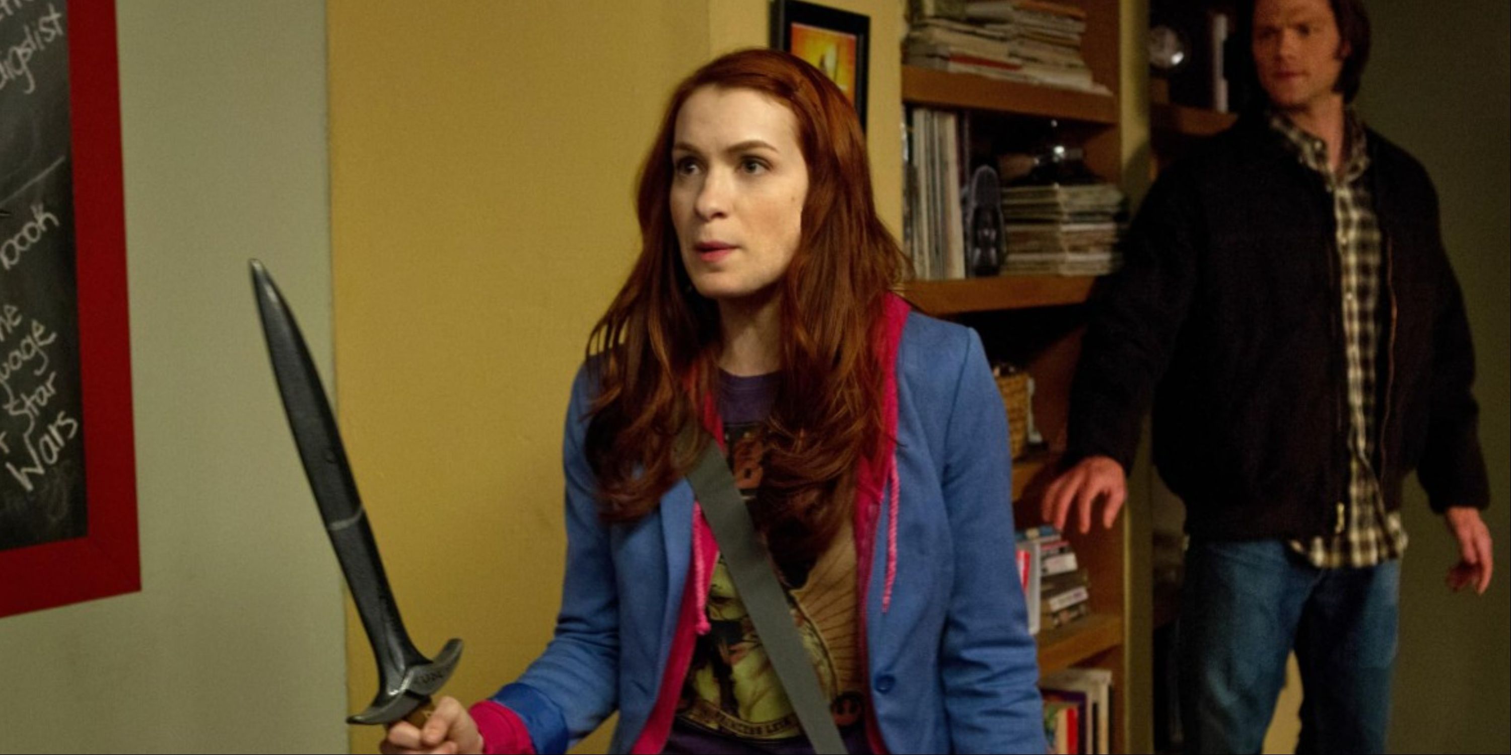 Felicia Day as Charlie in Supernatural with a dagger, Sam following behind her.