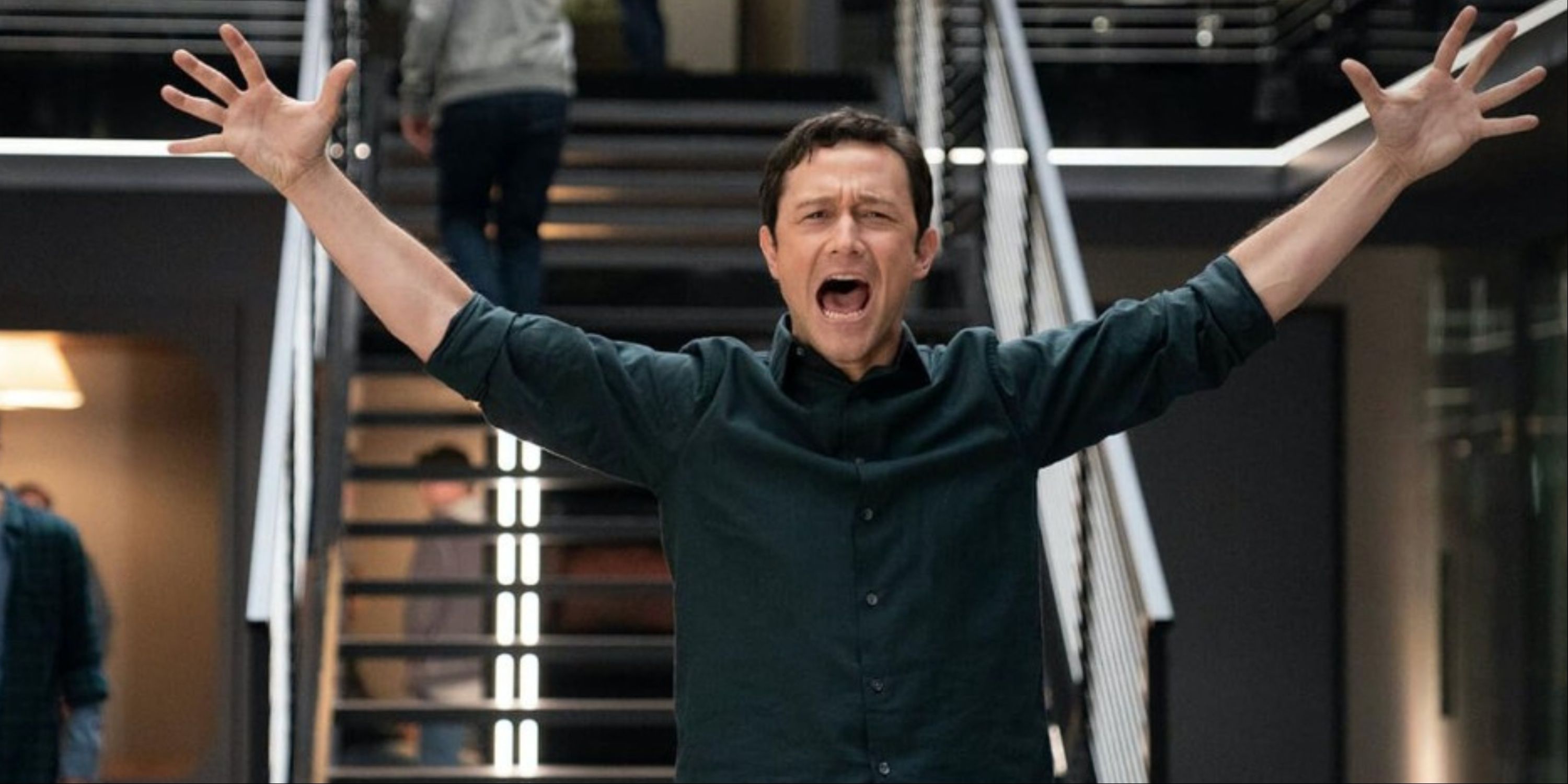 Joseph Gordon-Levitt excitedly throwing his hands up in his show.