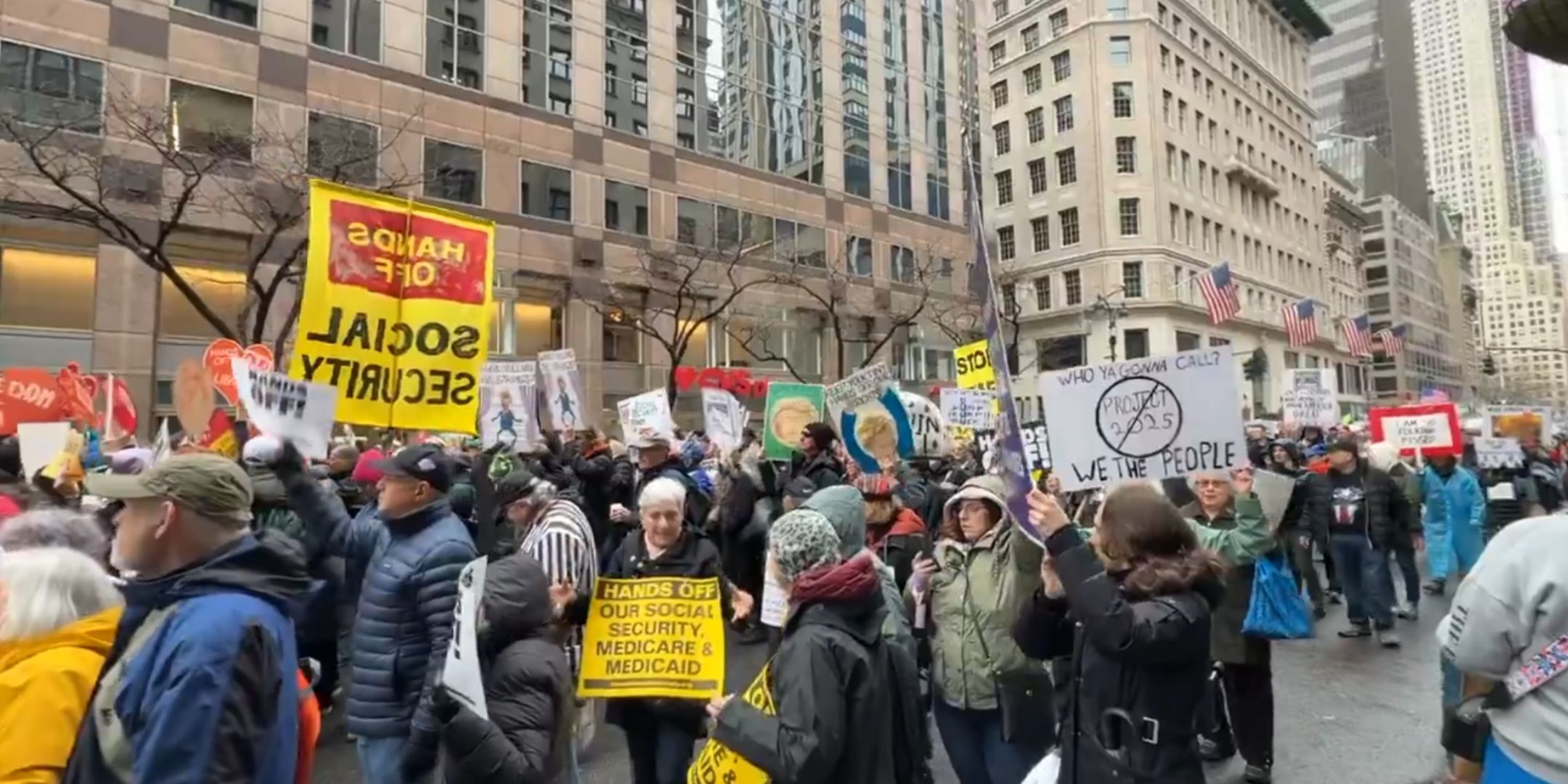 Thousands of protesters gathered in New York City, holding up anti-Trump signs