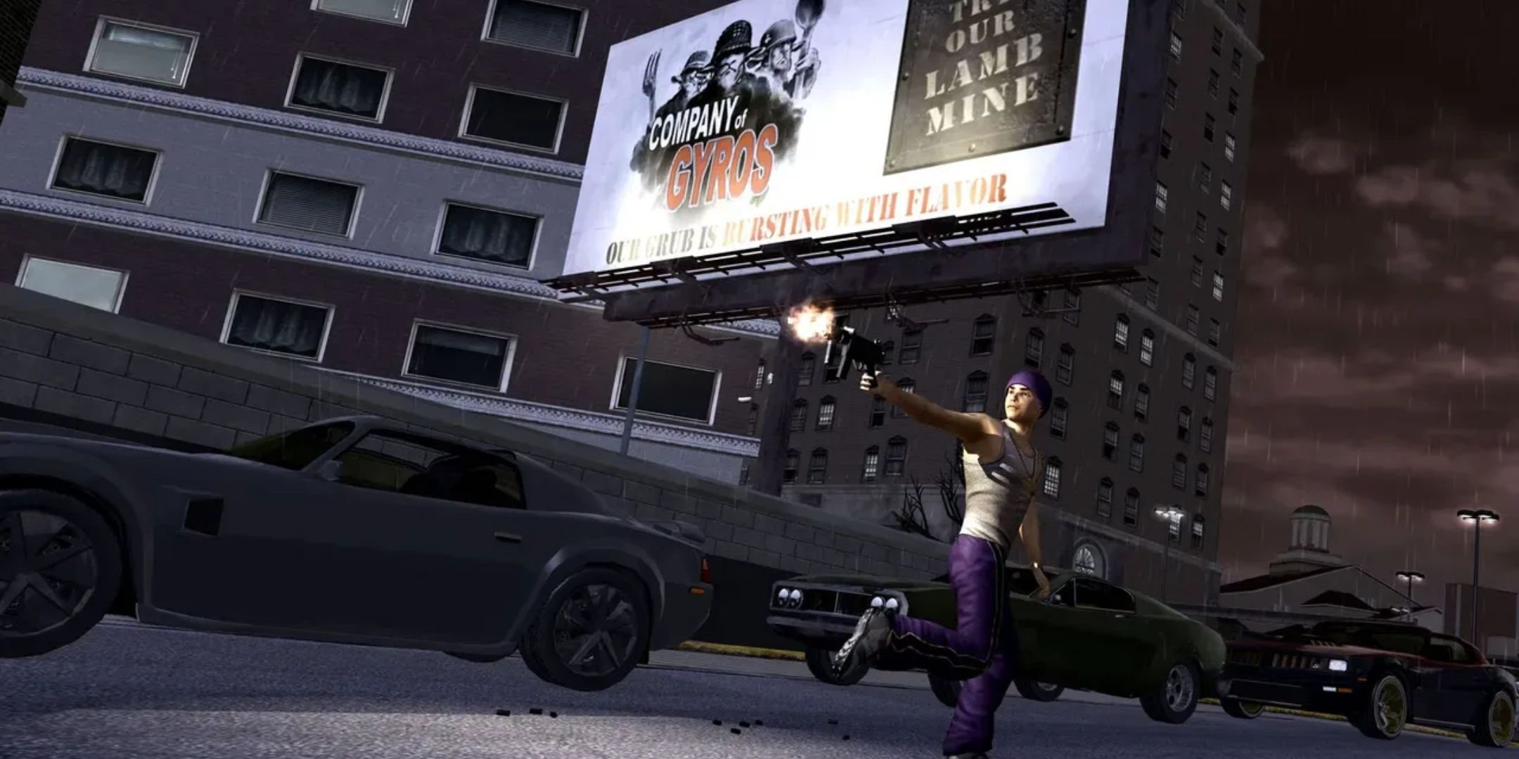 A member of the Saints shooting an uzi behind him by some cars at night in Saints Row 2.