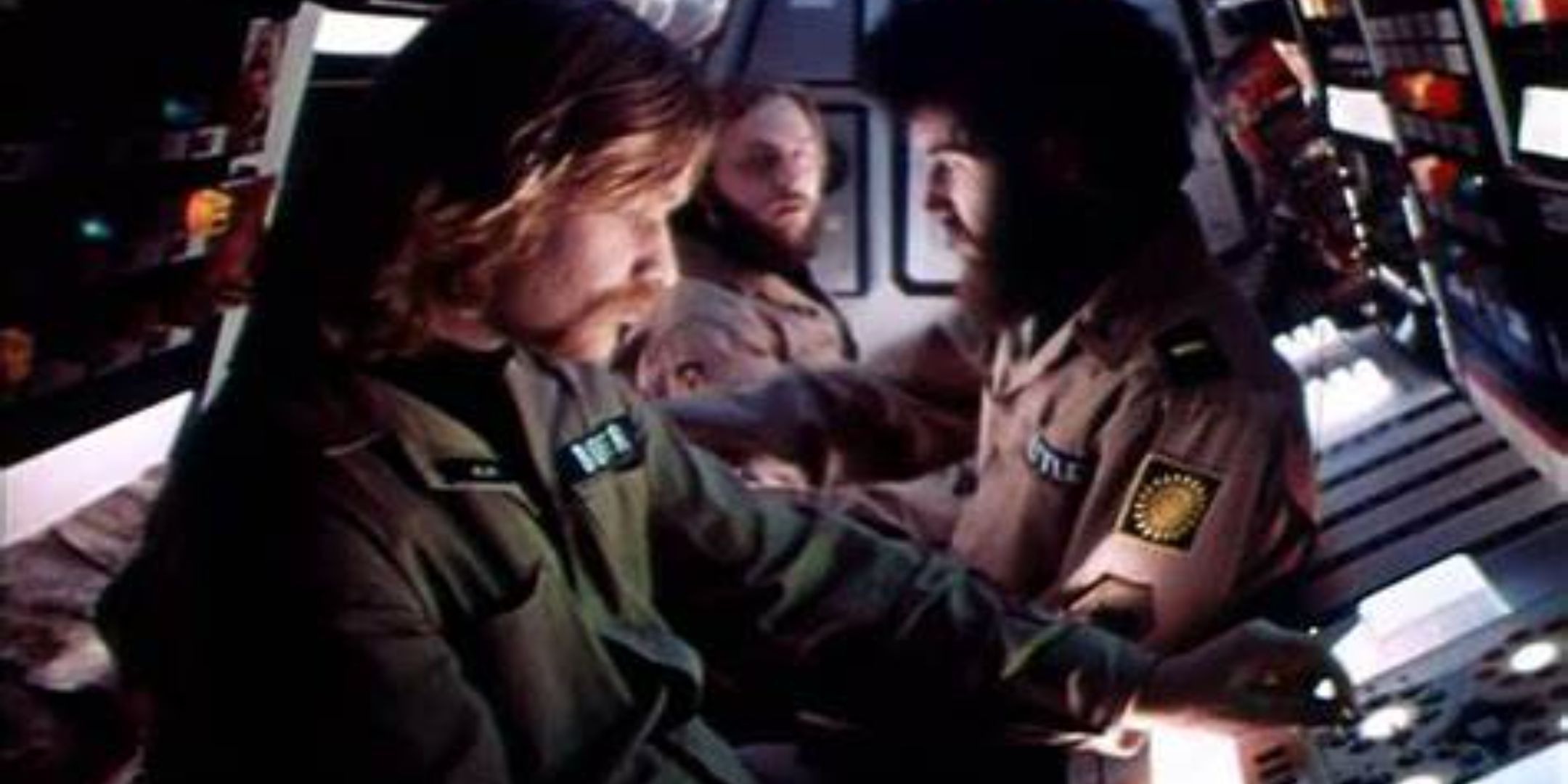 The crew of the ship from the movie Dark Star at their computer stations.