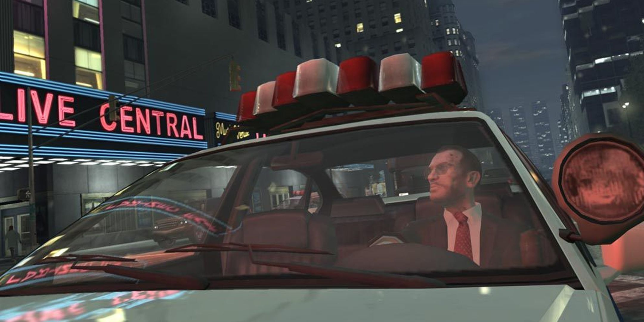 GTA 4 screenshot of Niko cruising in a police car. 