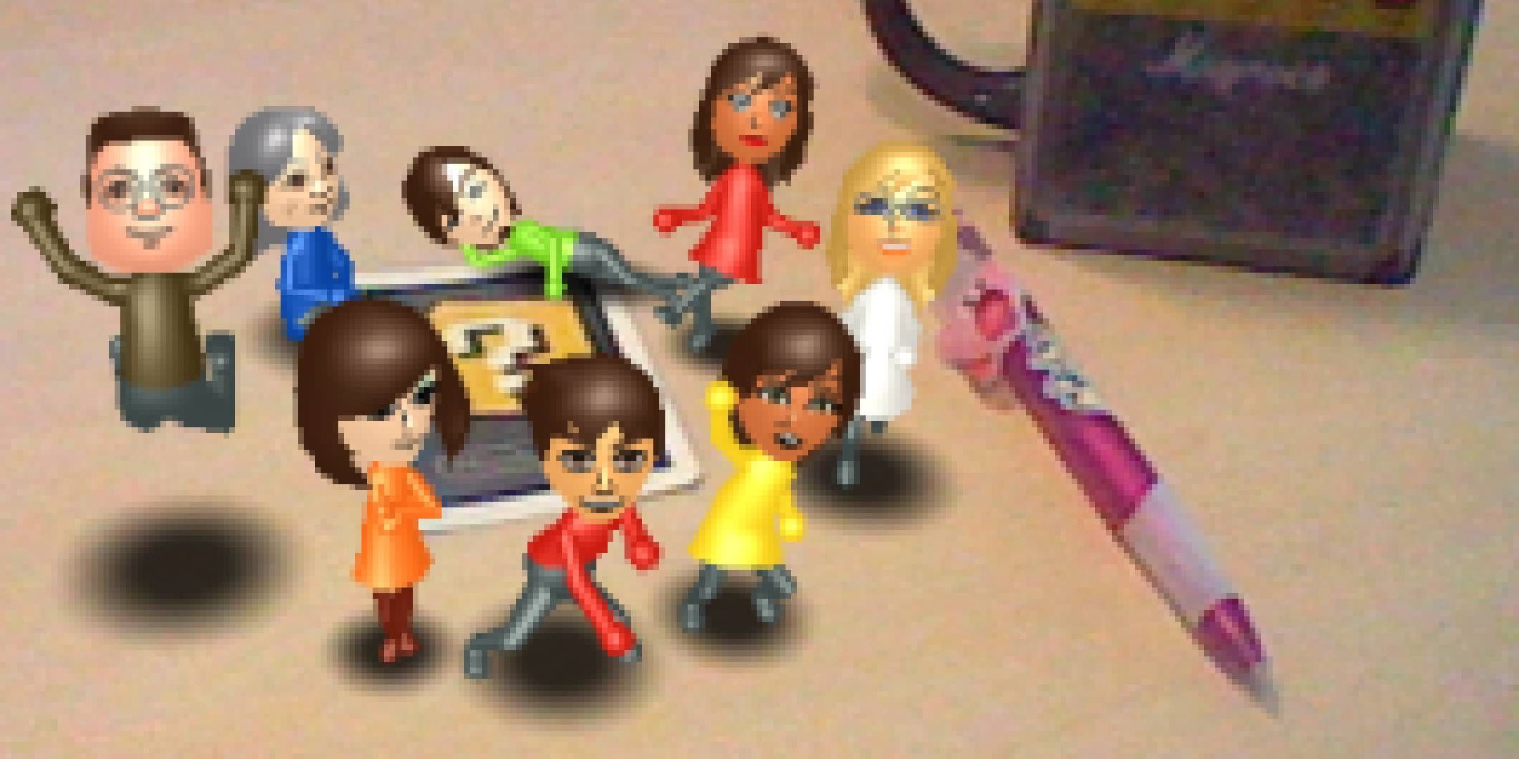 3DS camera photo mii's posing around an AR card.