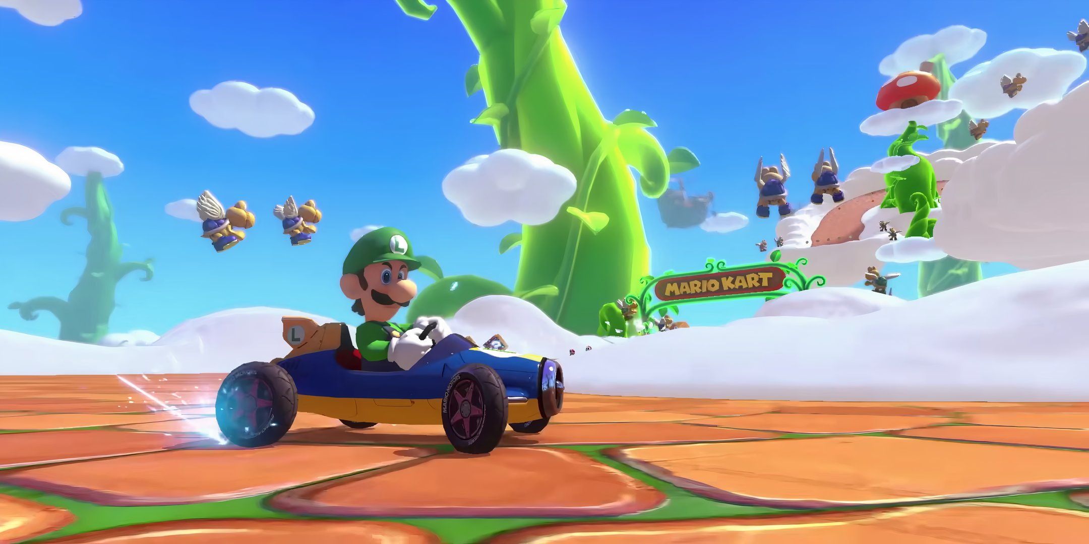 Luigi driving along in Mario Kart 8 Deluxe.