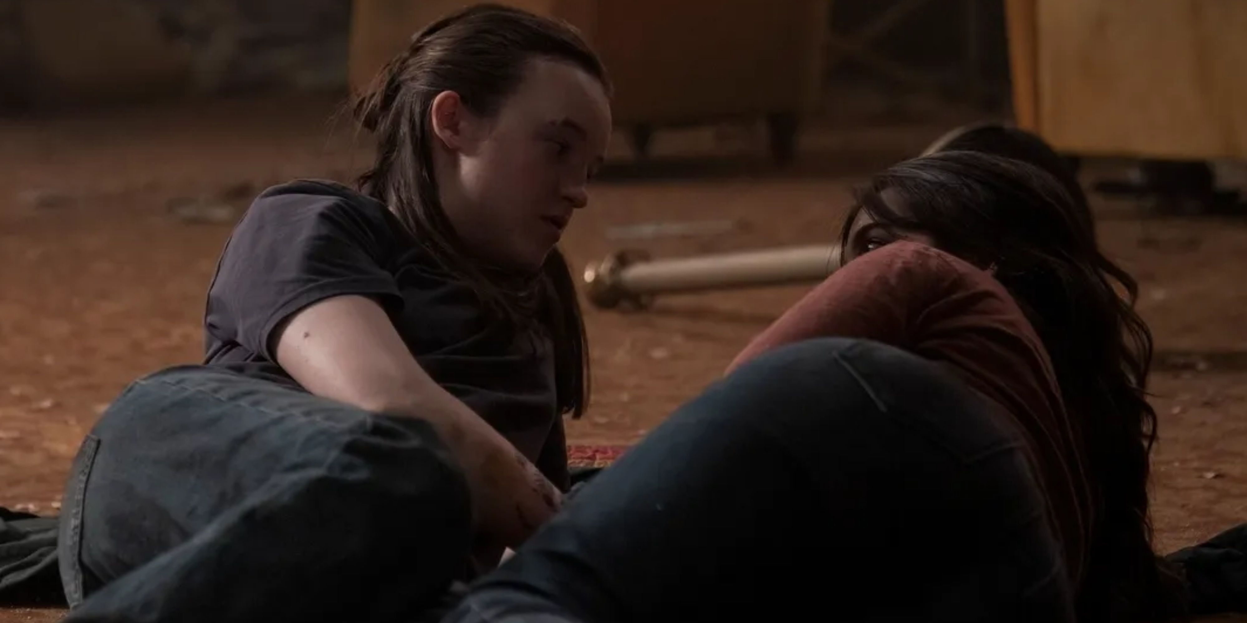 ellie and dina lying on the floor in the last of us.