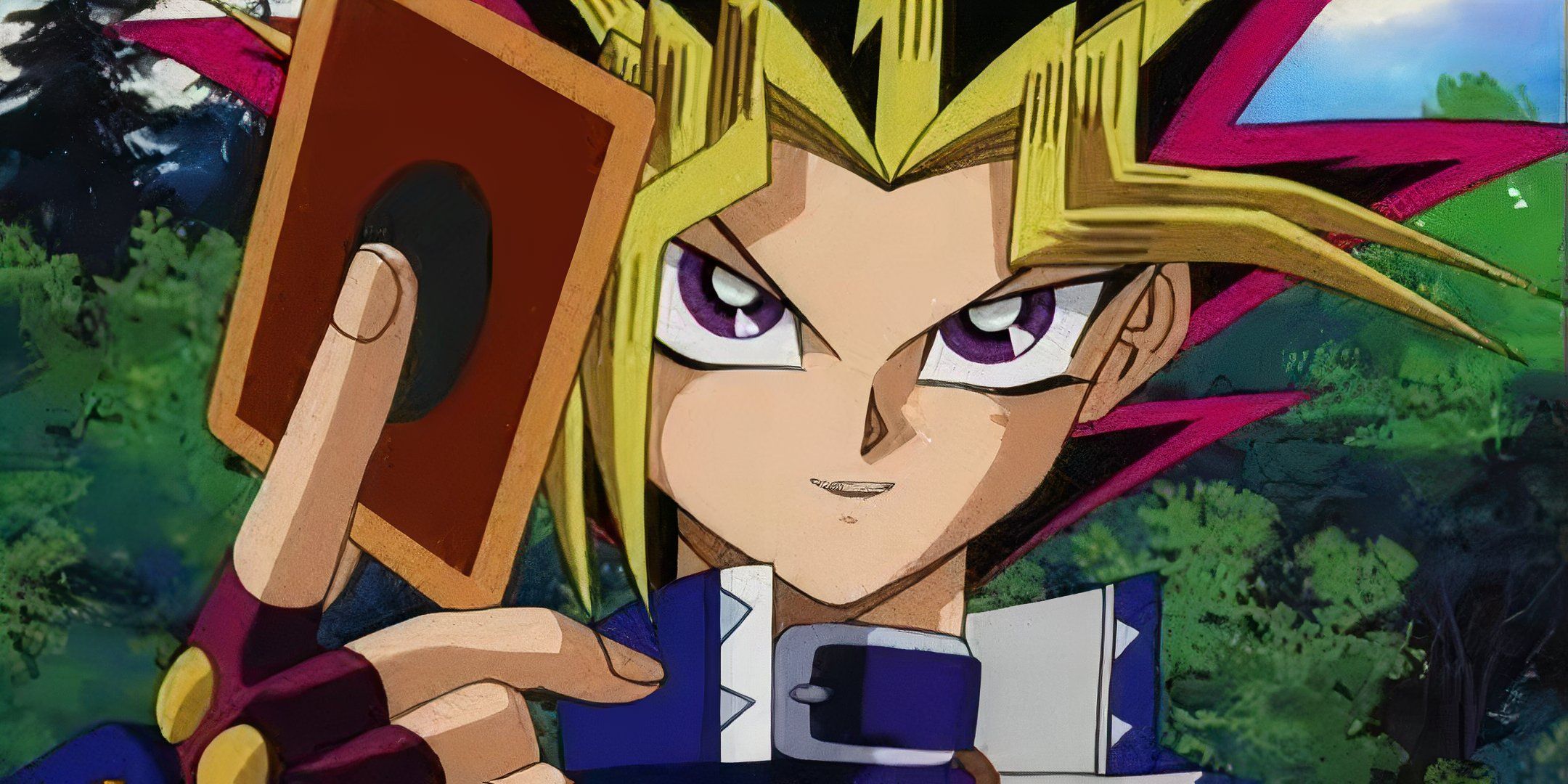 Yugi smugly holds out a card in Yu-Gi-Oh Duel Monsters.