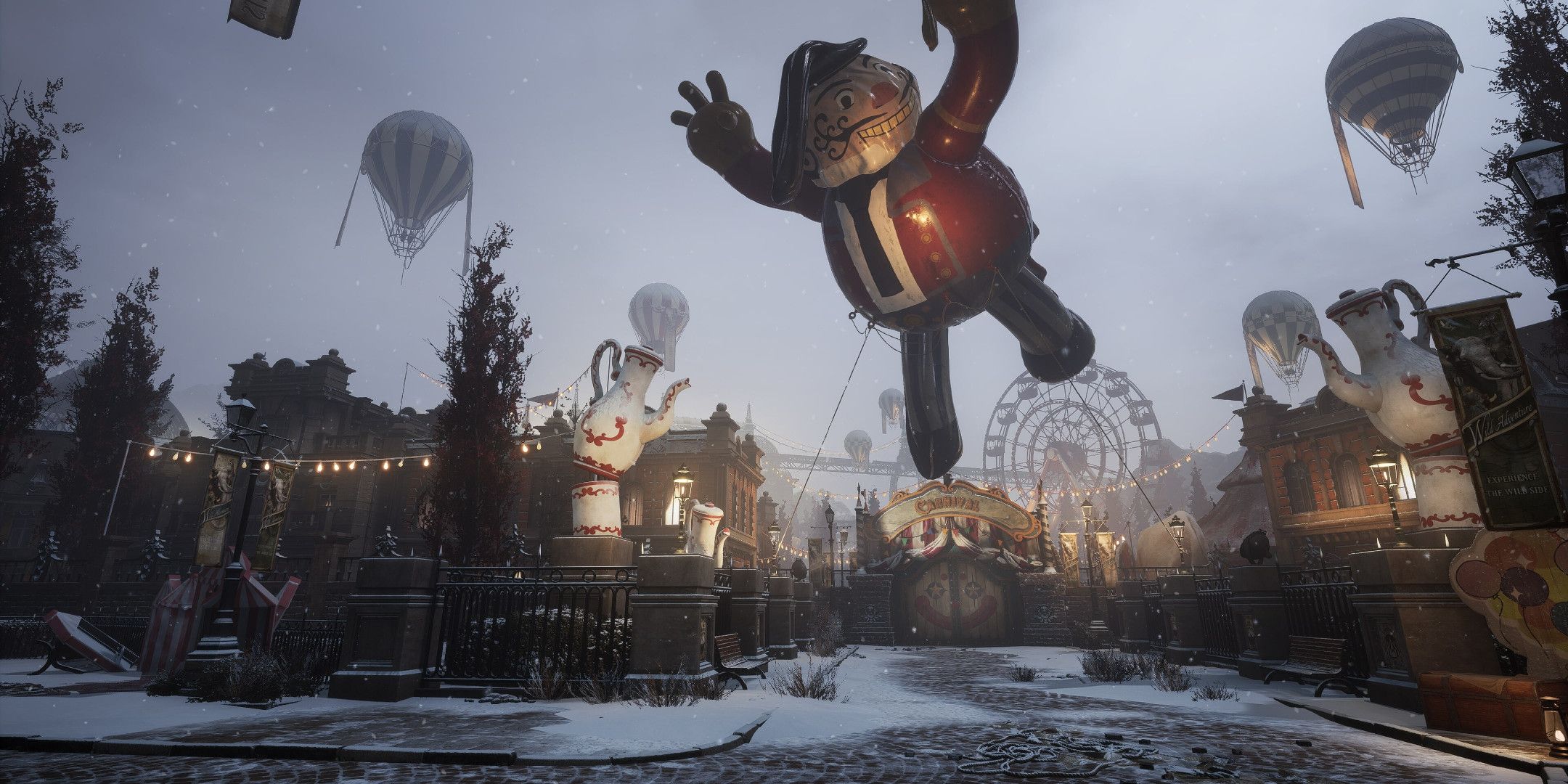 A carnival with a large floating blimp of a man.