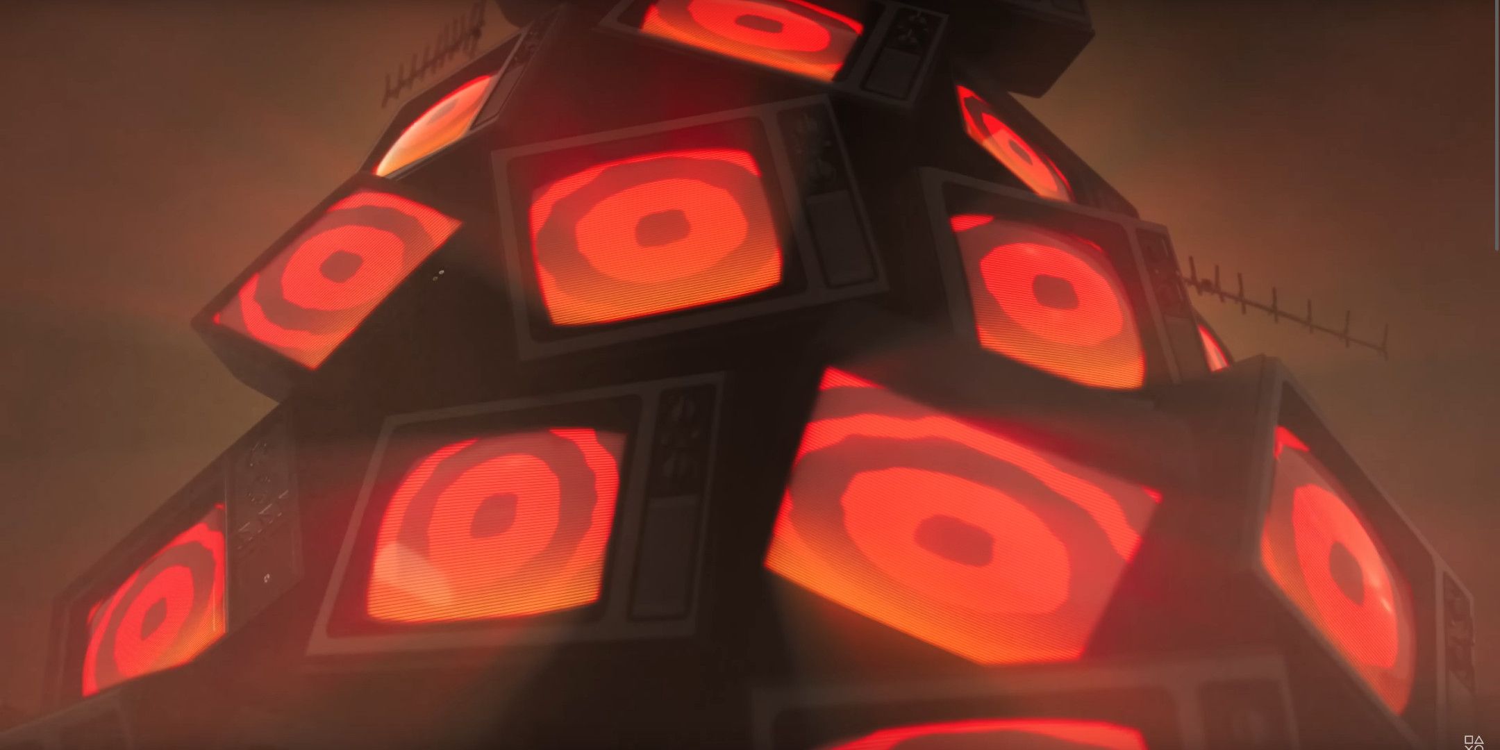 A pile of TVs with a red pattern of them.