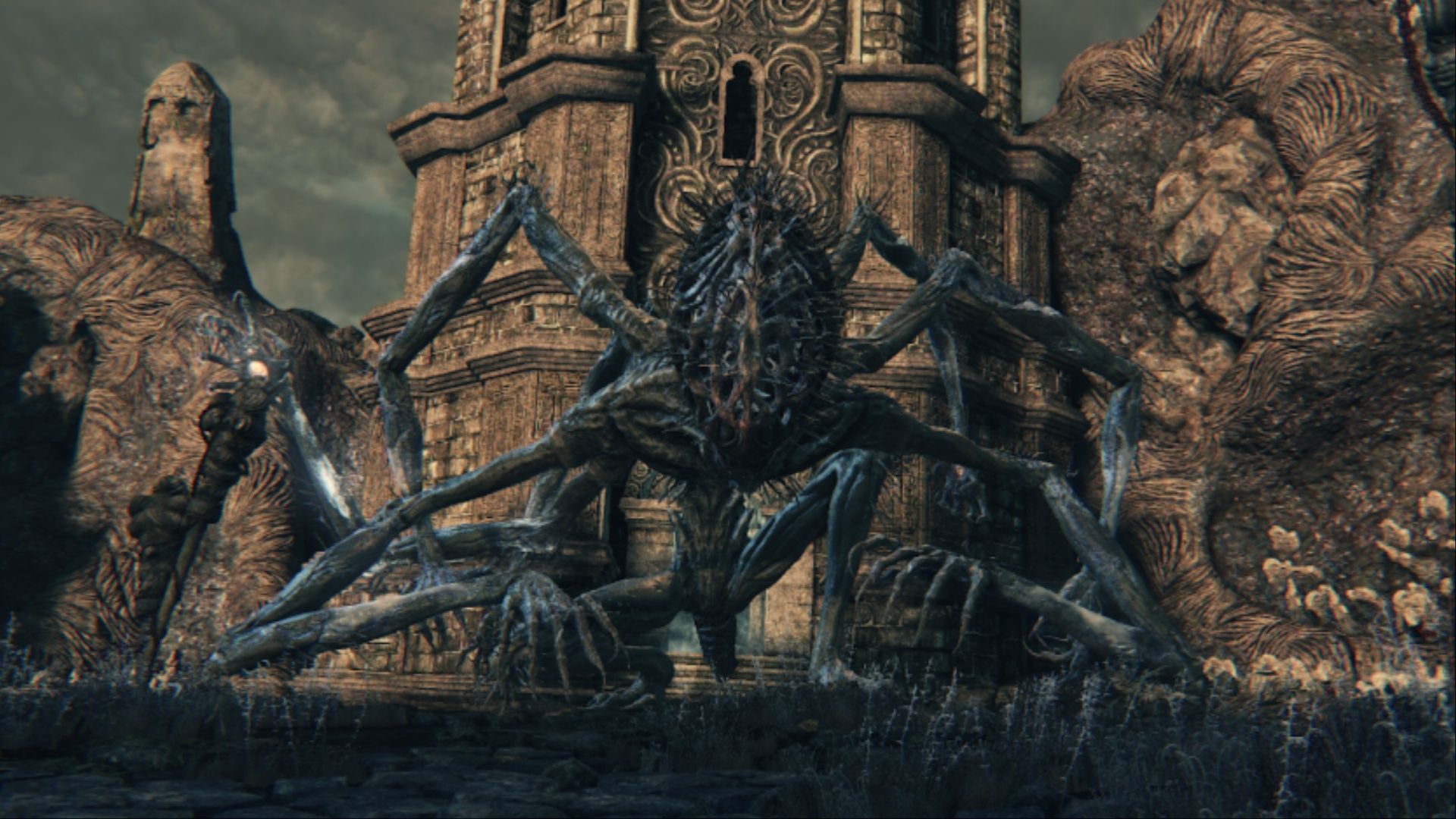 Amygdala resting in front of the lift tower in Bloodborne.
