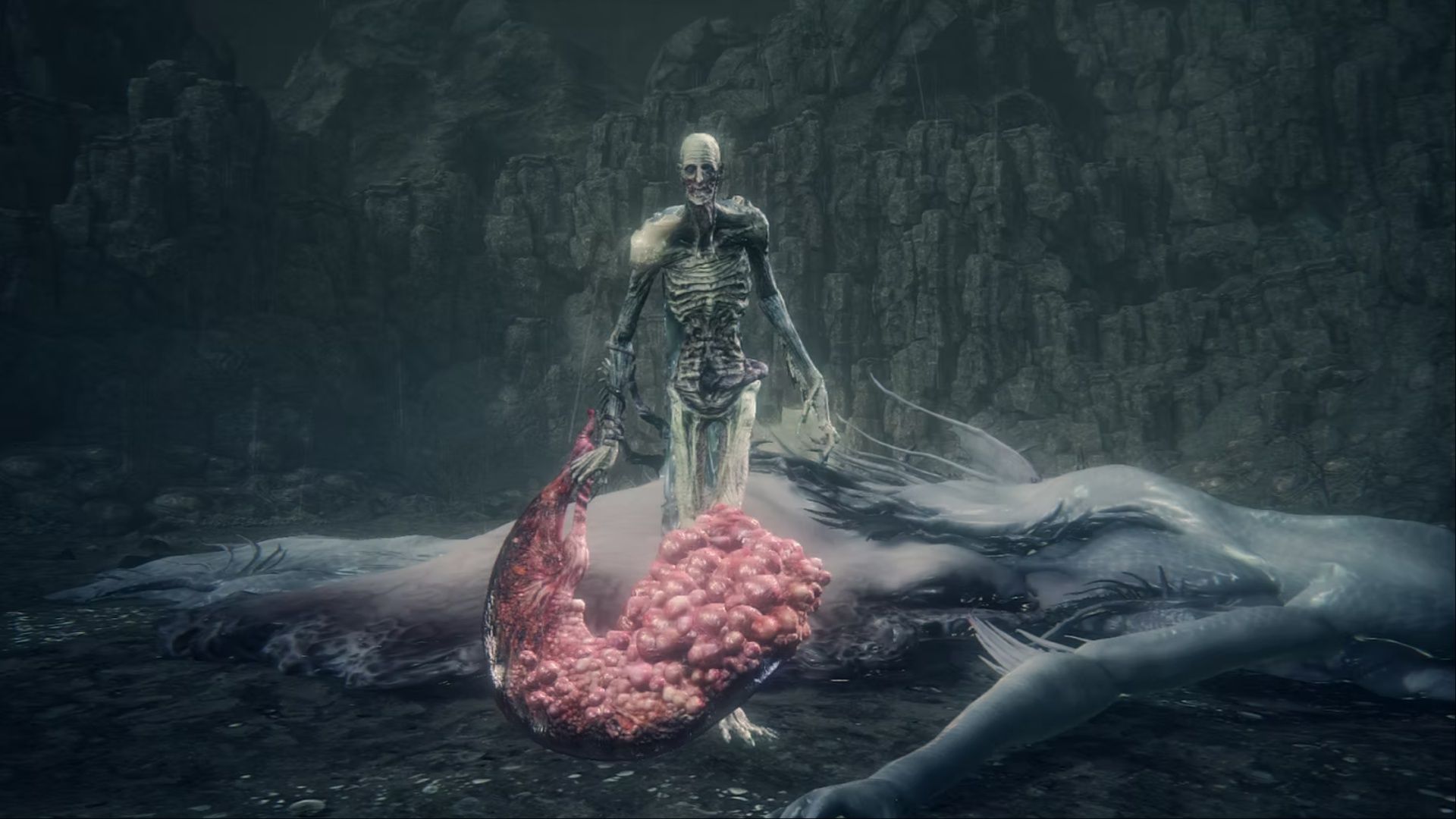 Orphan of Kos walking toward the camera holding his placenta, which he wields as a weapon, in Bloodborne.