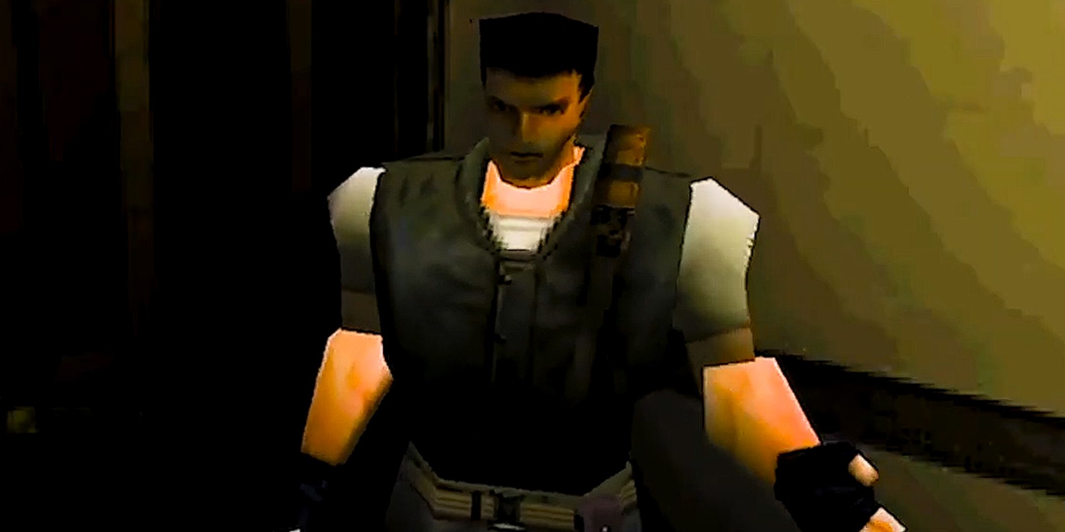 Chris Redfield from the original Resident Evil standing in a dimly lit corridor.