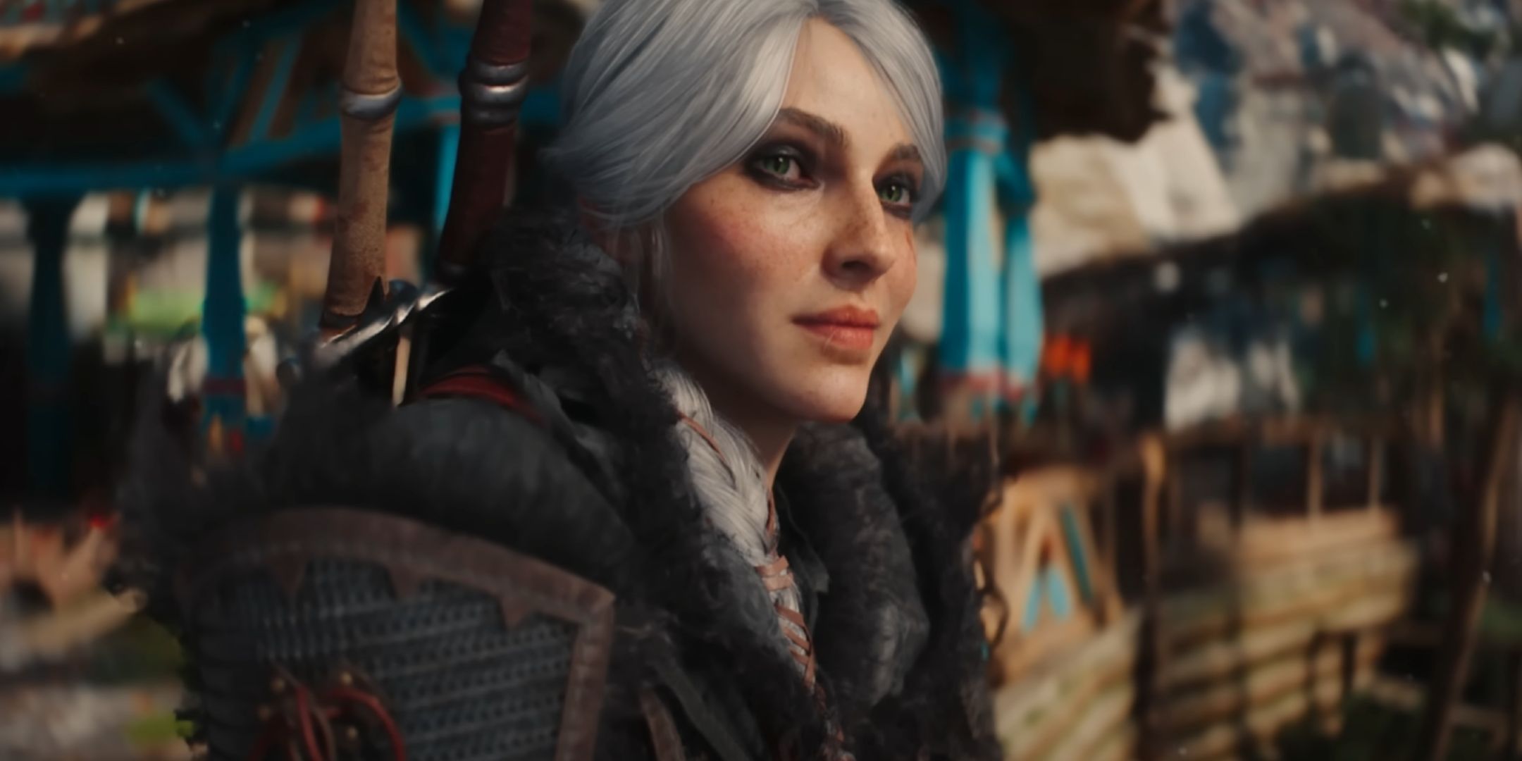 Ciri smiling in The Witcher 4. She has white hair and green eyes. She is wearing dark clothes and dark makeup around her eyes.