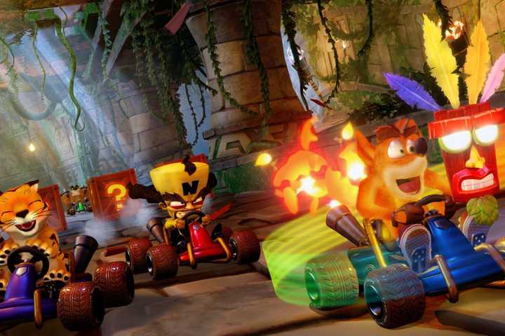 Crash, Cortex, and Pura racing around in Crash Team Racing: Nitro-Fueled.