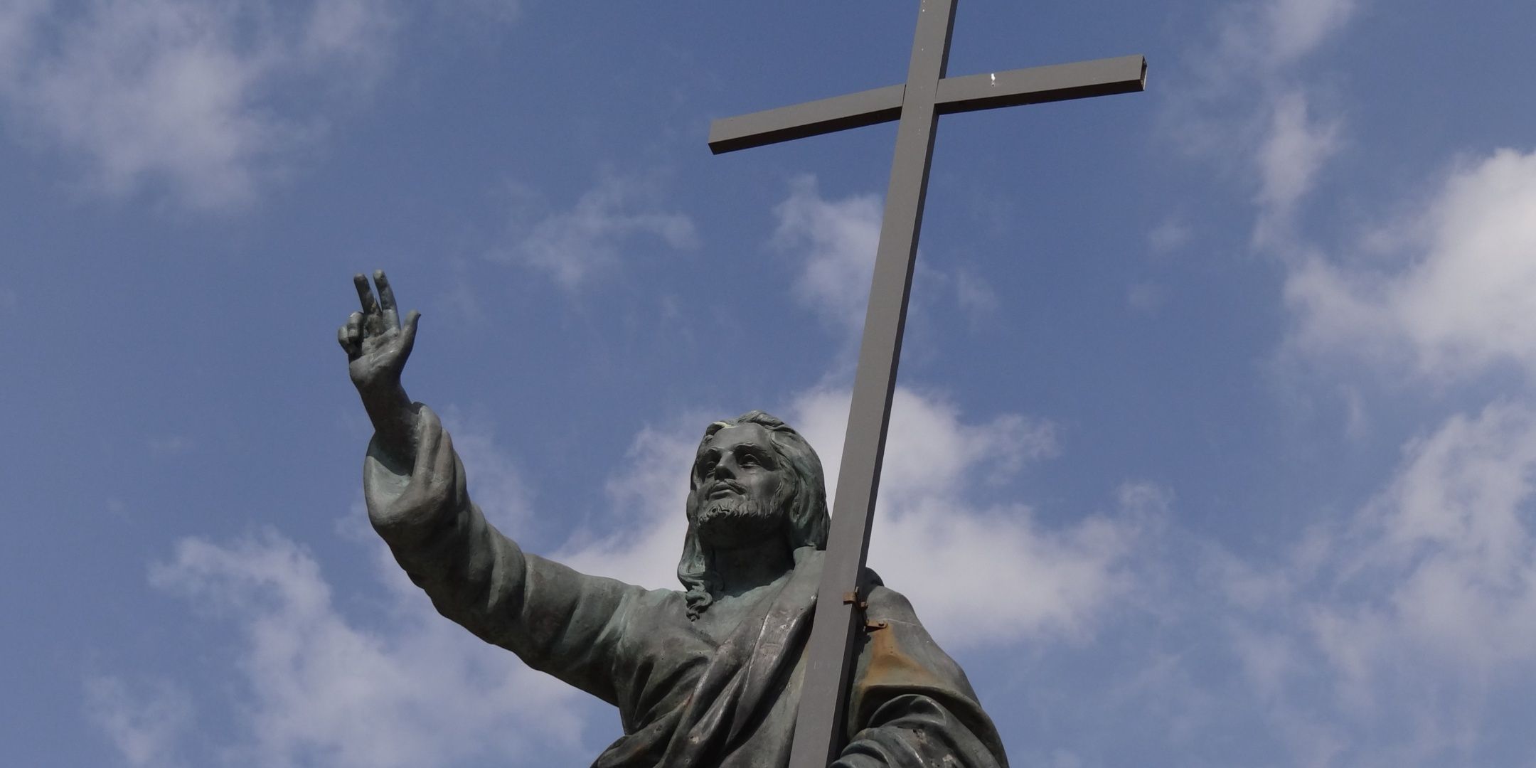 A statue of Jesus holding a cross.