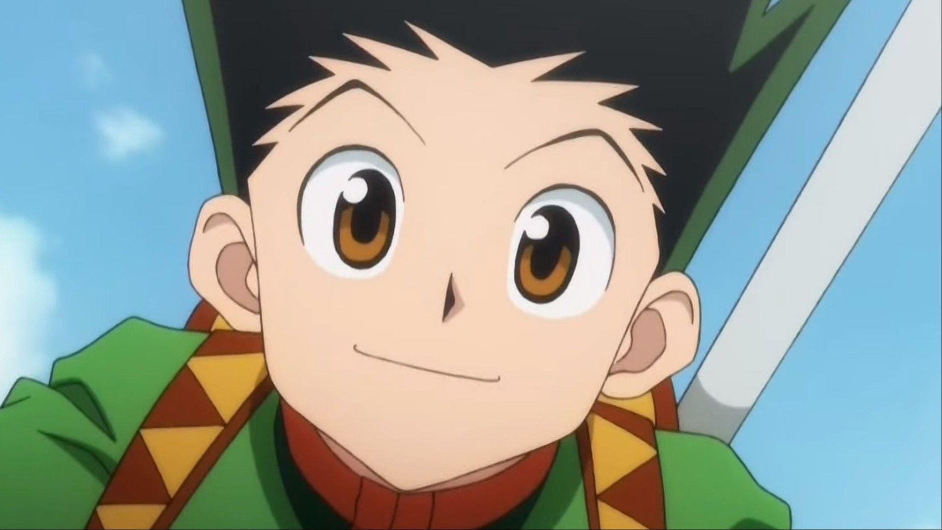 Gon smiling at the camera with a look of determination in Hunter x Hunter.