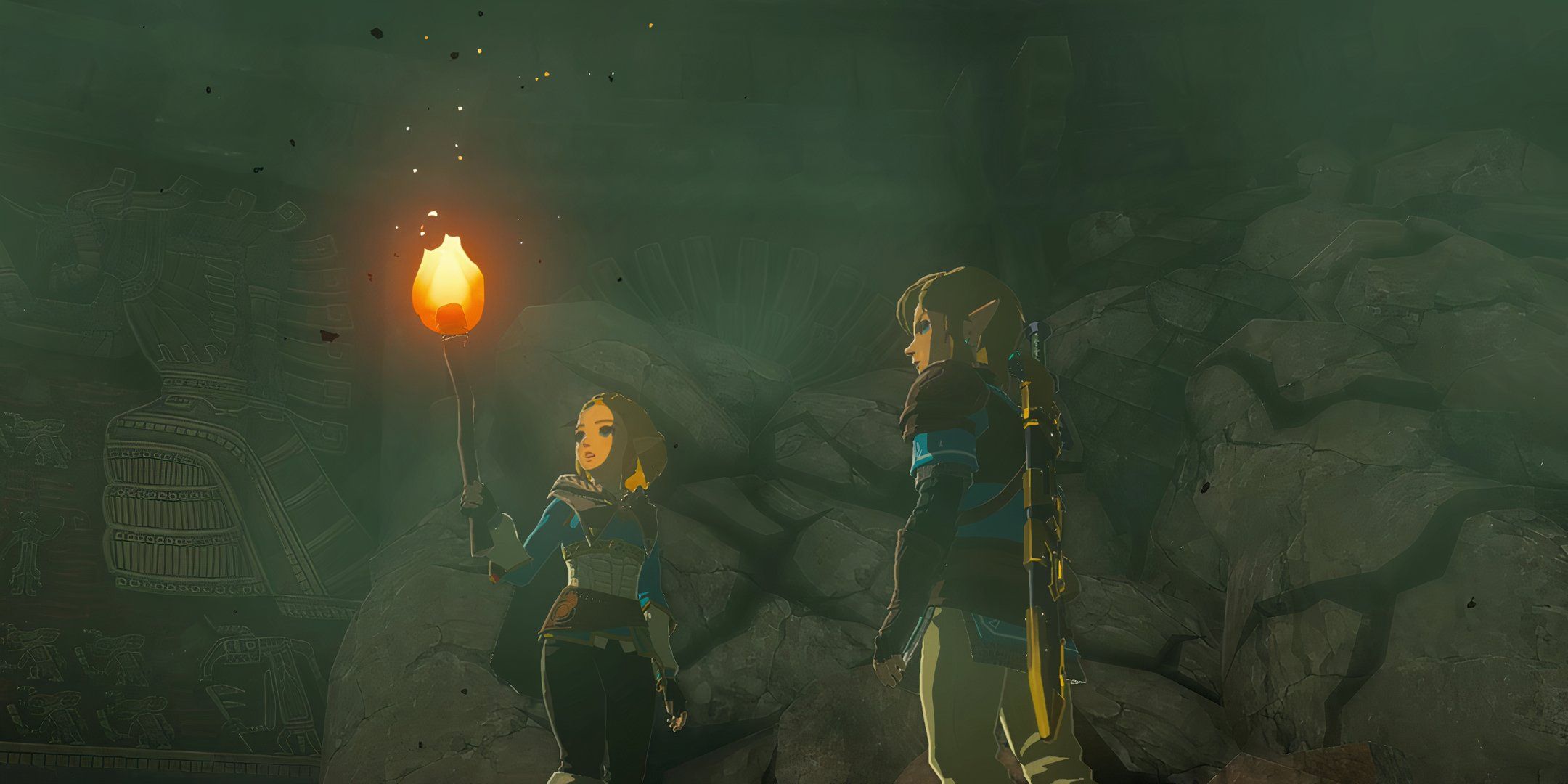 Link and Zelda standing in a cave with a torch in The Legend of Zelda: Tears of the Kingdom.