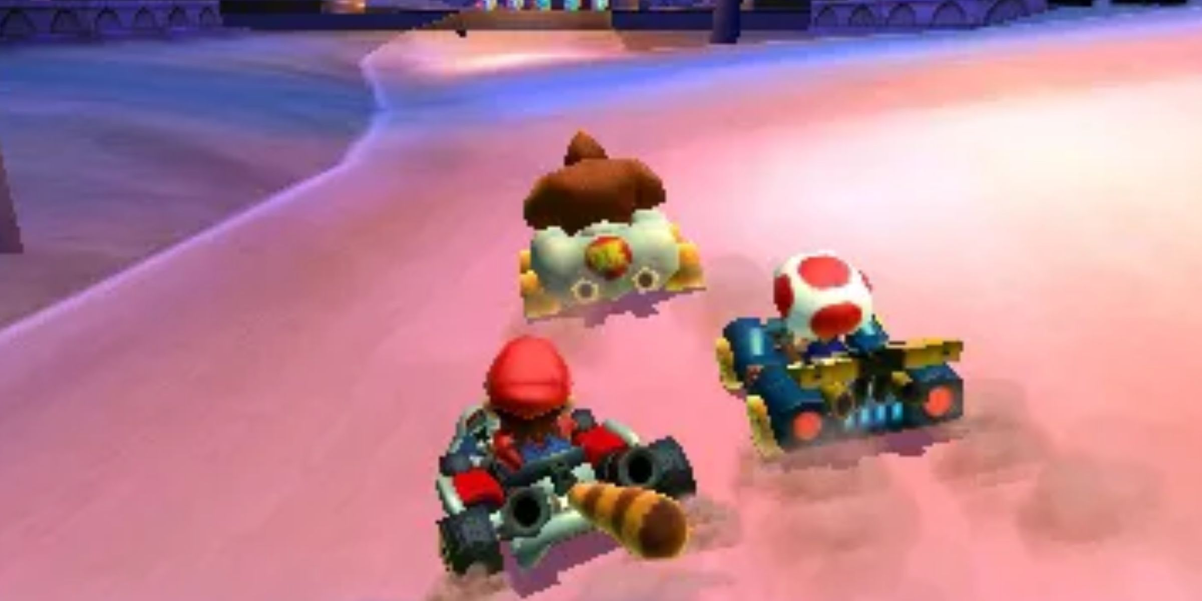 Mario, DK and Toad racing through Shy Guy Bazar in Mario Kart 7.