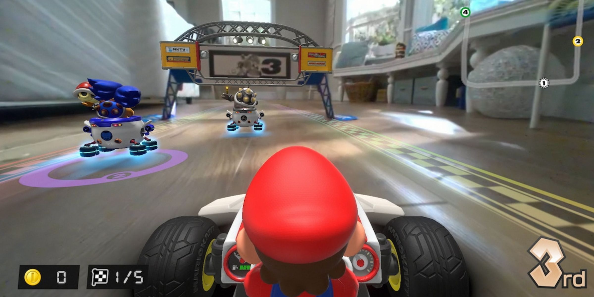 Mario racing against the Koopalings in someone's real house in Mario Kart Live: Home Circuit.