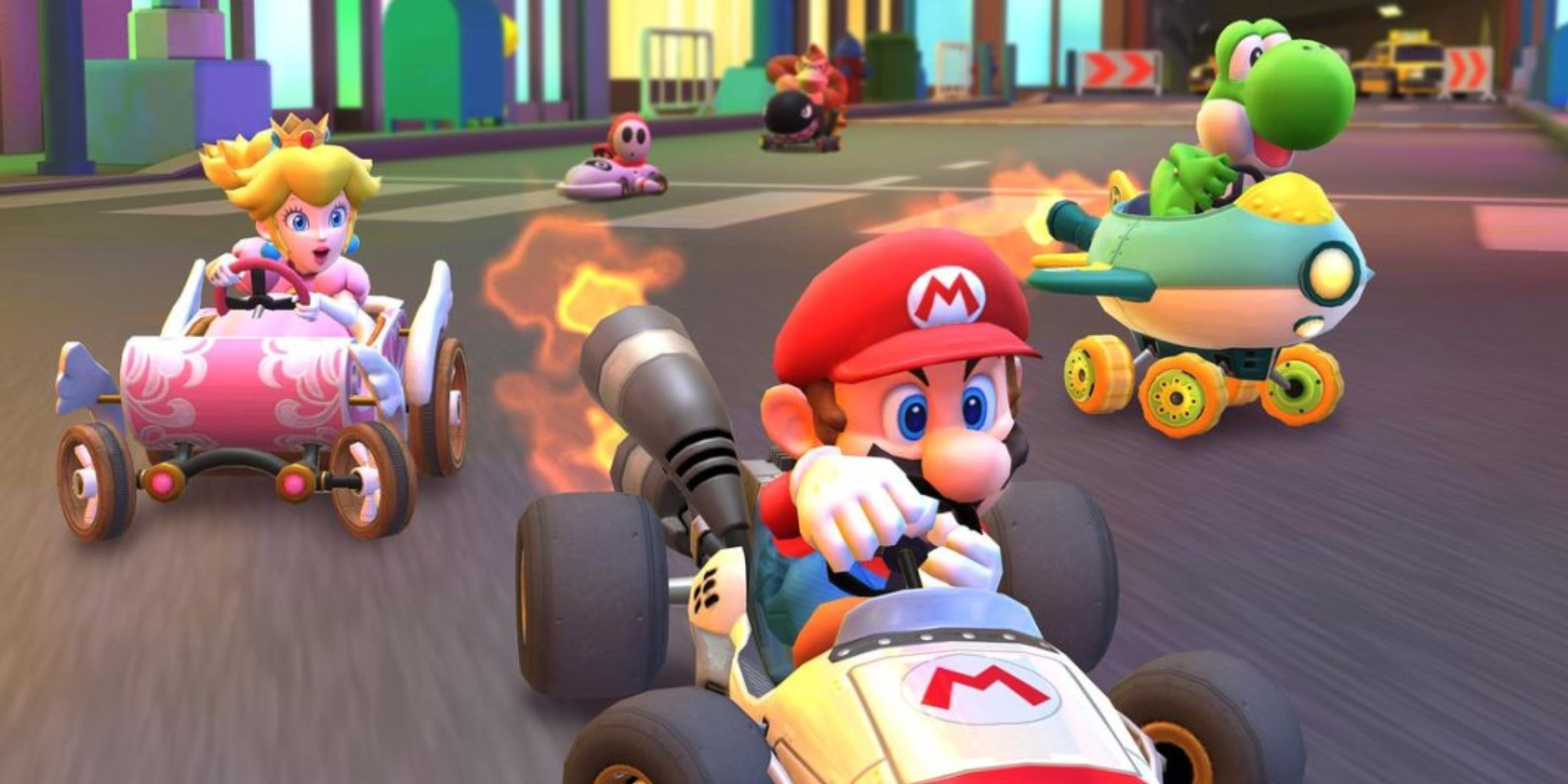 Mario, Yoshi, Peach and others racing through New York Minute in Mario Kart Tour.
