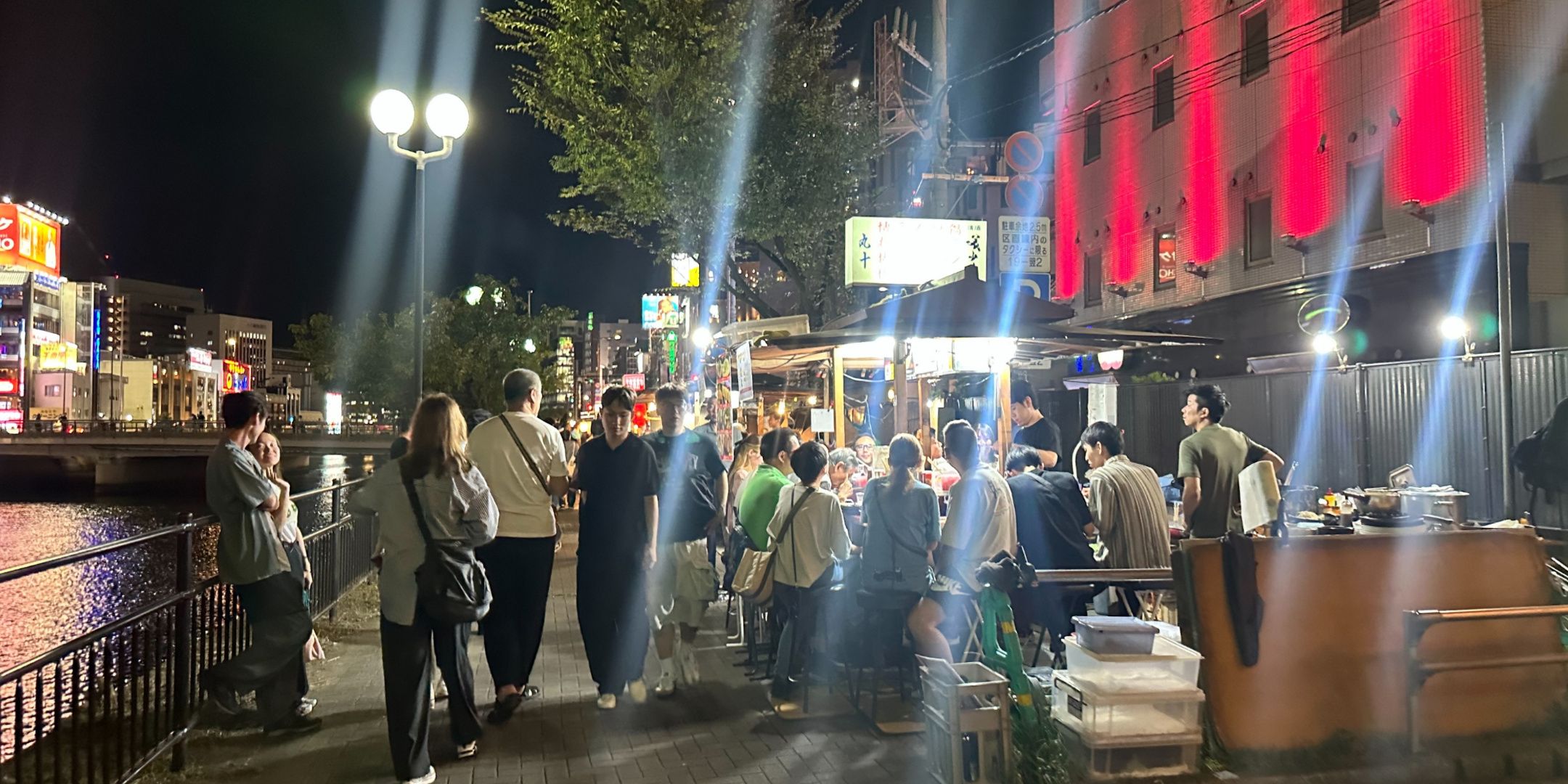 People eating in some food stalls in Fukuoka.
