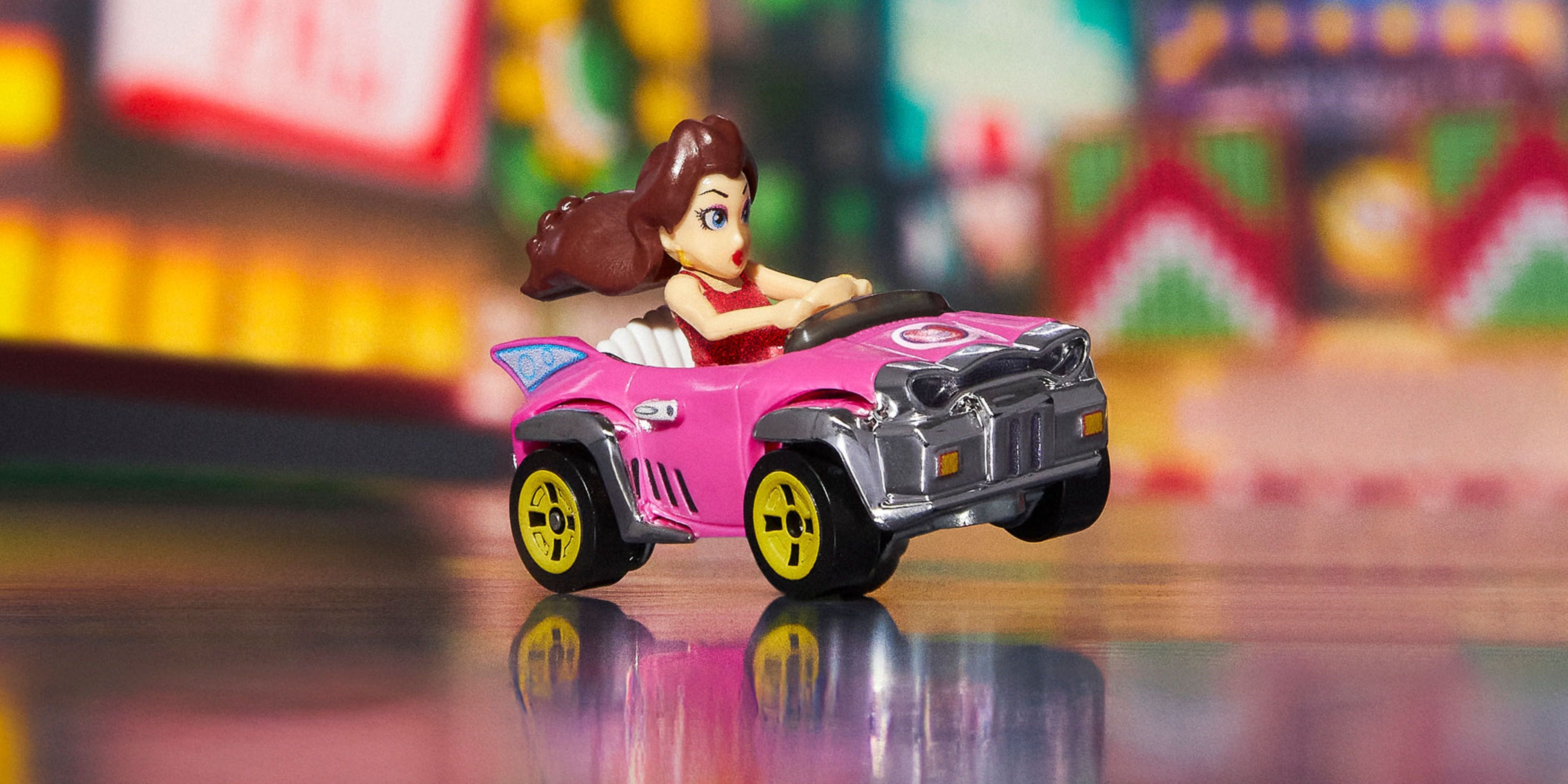 pauline's mario kart hot wheels car up on two wheels.